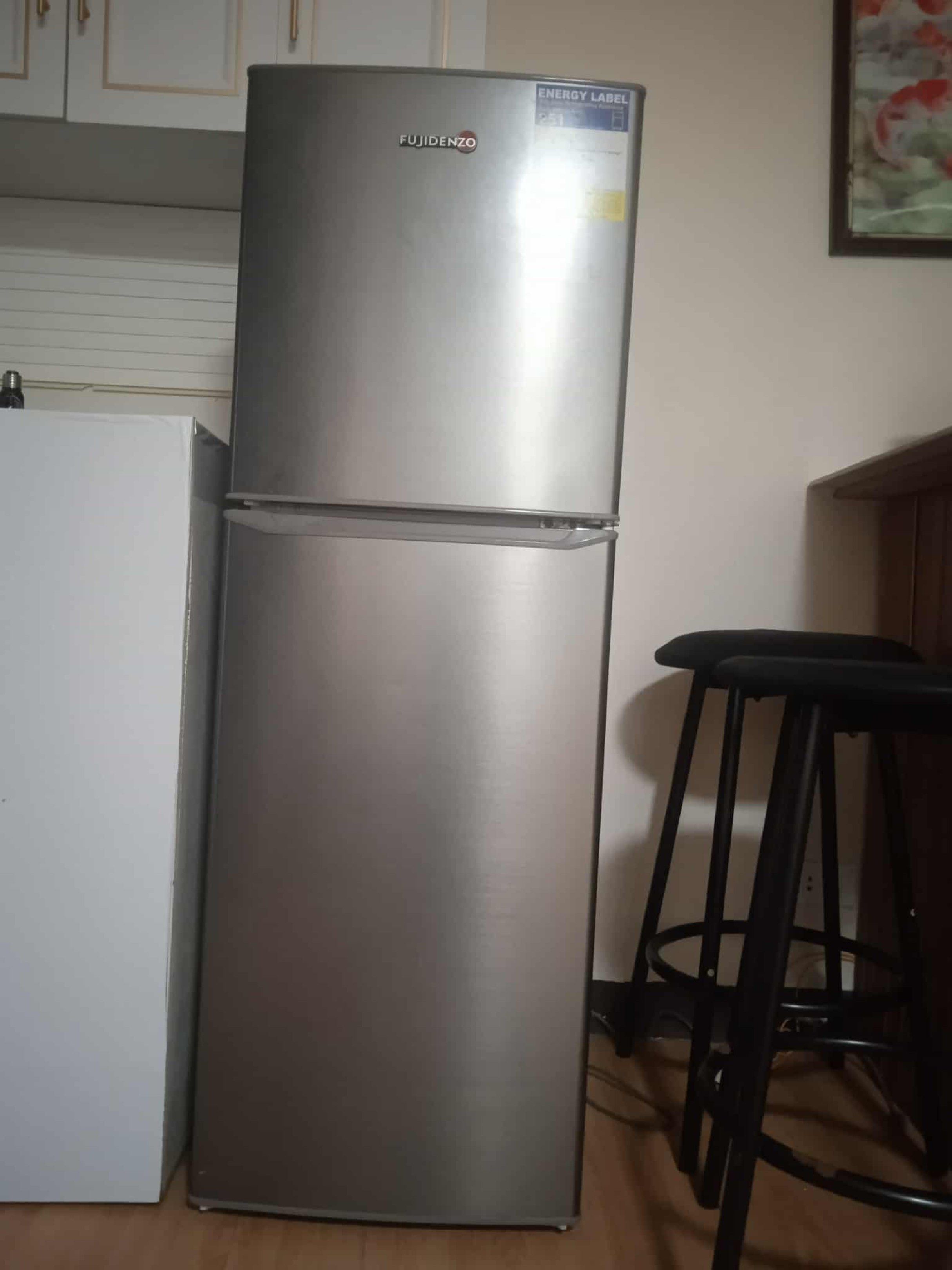 Fujidenzo Two-Door Refrigerator (Category: Refrigerators and Freezers) located in Manila. Submitted by clonebagsph (Listing ID 1418961811, Image 3). Description: - Fujidenzo two-door refrigerator - Top freezer and bottom refrigerator design - Silver exterior - Multiple shelves and door compartments - Clean interior - Includes energy label .