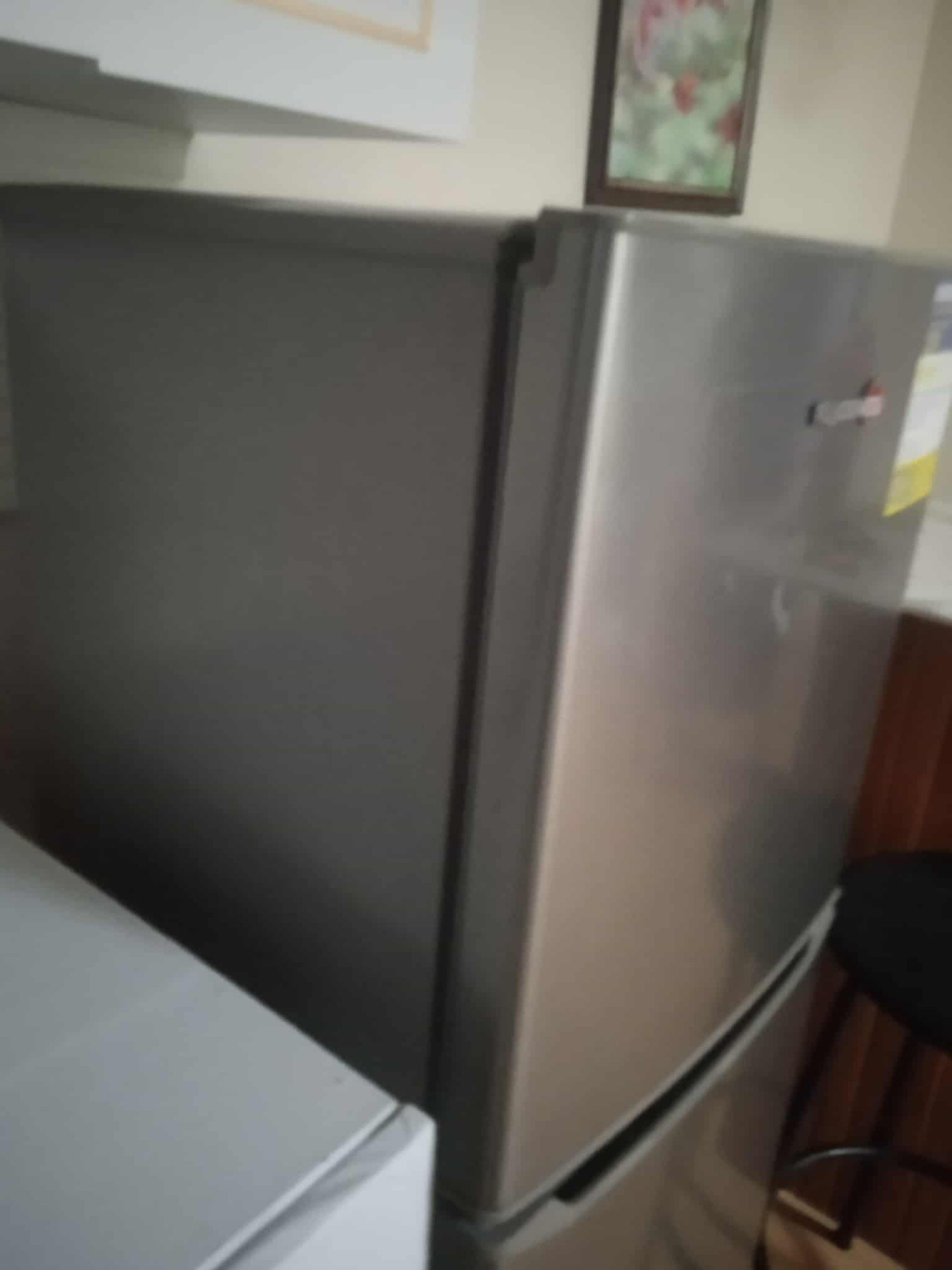 Fujidenzo Two-Door Refrigerator (Category: Refrigerators and Freezers) located in Manila. Submitted by clonebagsph (Listing ID 1418961811, Image 2). Description: - Fujidenzo two-door refrigerator - Top freezer and bottom refrigerator design - Silver exterior - Multiple shelves and door compartments - Clean interior - Includes energy label .