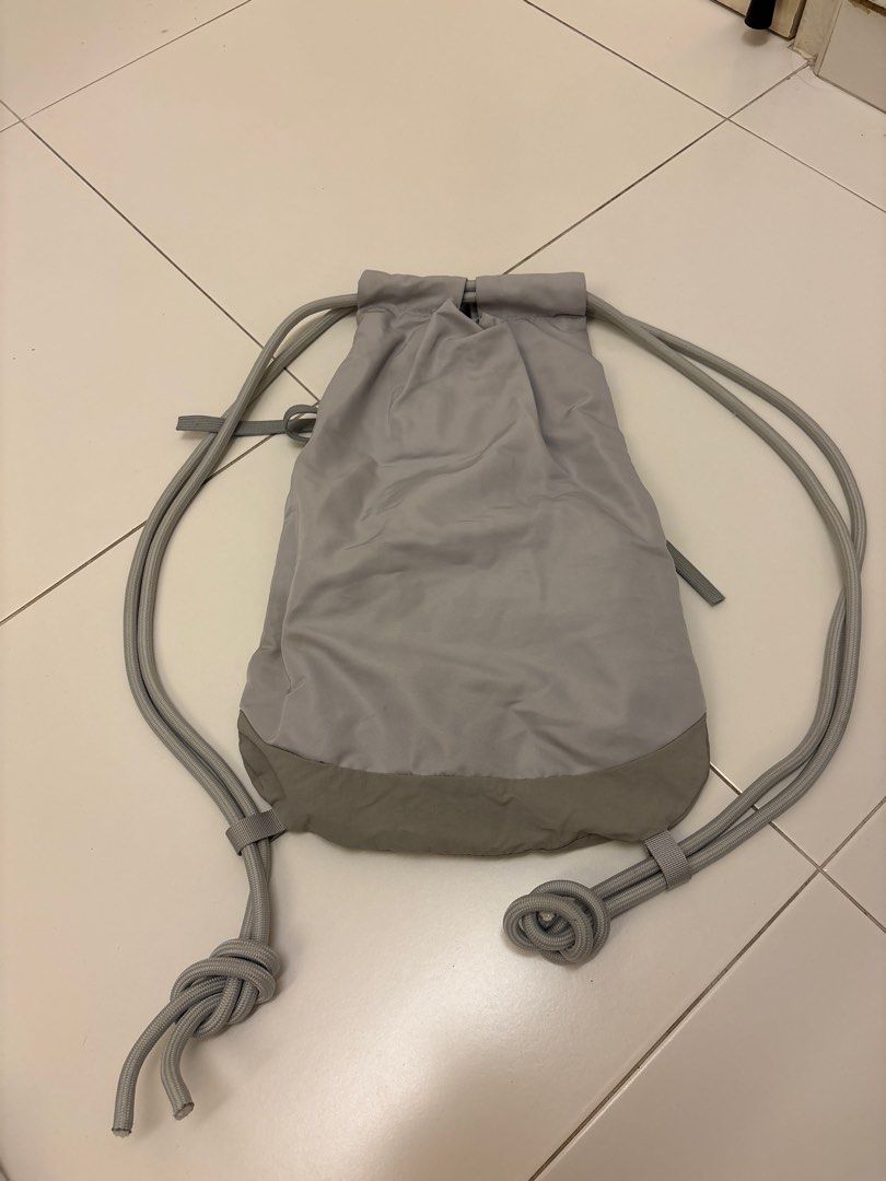 Grey Drawstring Backpack (Category: Backpacks) located in Singapore. Submitted by crystalcar (Listing ID 1418956243, Image 2). Description: - Grey drawstring backpack - Front mesh pocket - Secure drawstring closure - Perfect for gym, travel, and everyday use.