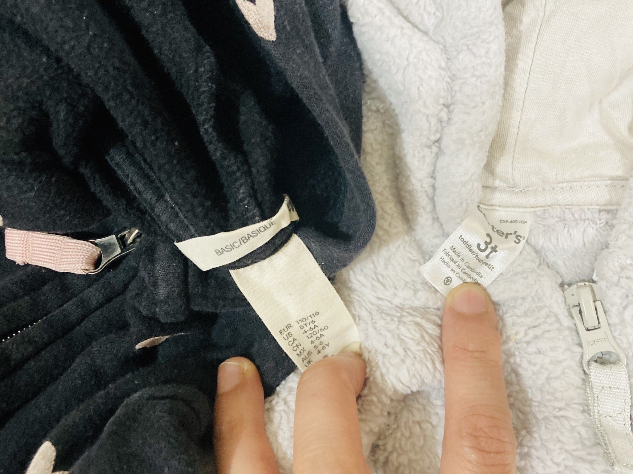 H&M and Carter's Toddler Hoodies bundle (Category: Babies & Kids Fashion) located in La Trinidad. Submitted by secondsmatter (Listing ID 1418901432, Image 2). Description: - Two toddler hoodies for sale! - Includes: - Black H&M hoodie with heart patterns and zipper closure. - Gray Carter's bear-themed hoodie from Carter's (size 3T). - Both hoodies feature: - Hoods - Long sleeves - Perfect for keeping your little one warm and stylish!.