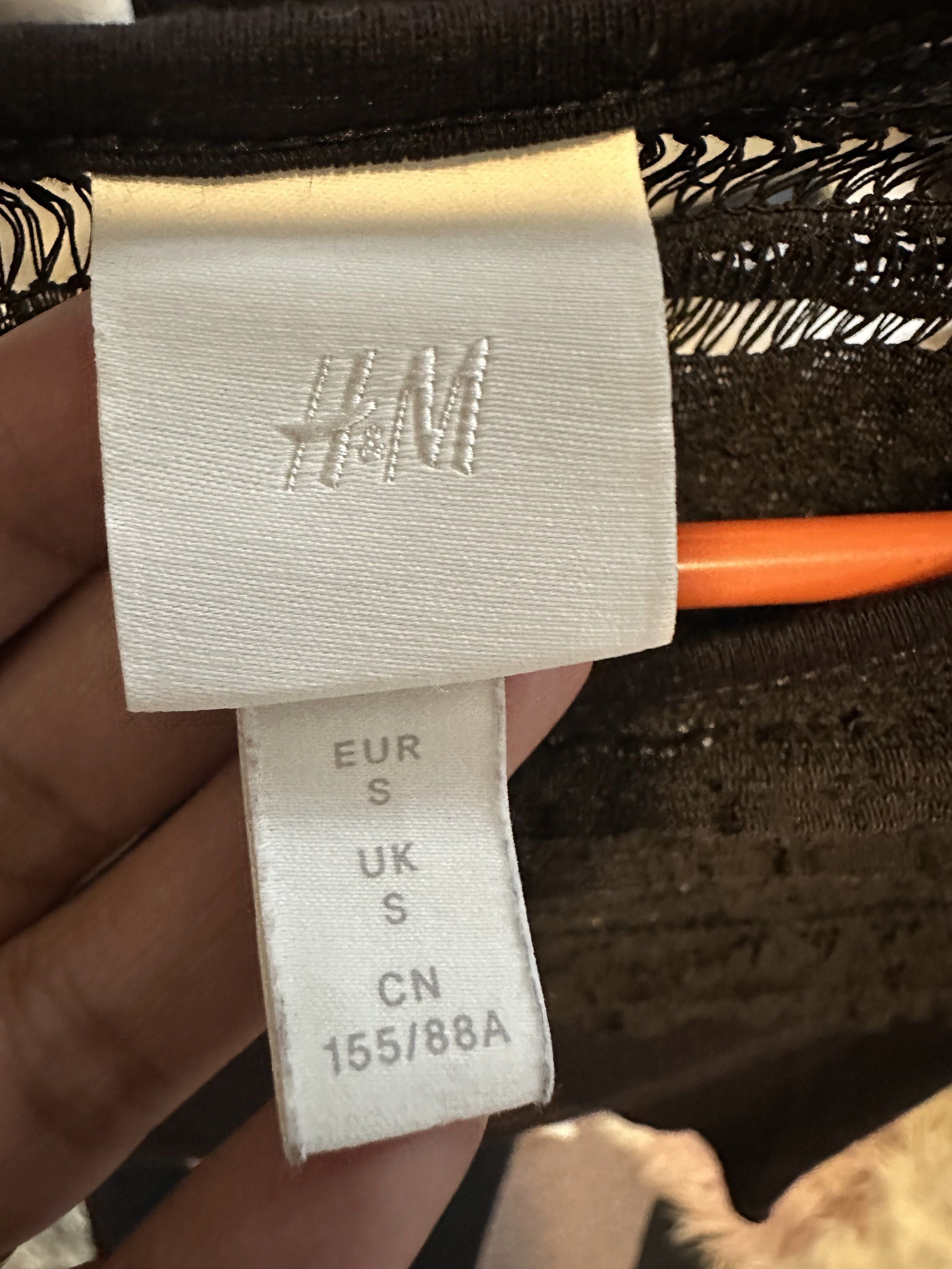 H&M Black Lace Top - Size S (Category: Blouses) located in Makati City. Submitted by ideclutteritems.ph (Listing ID 1418854808, Image 2). Description: - H&M black top - Size: S - Features lace detail on chest and shoulders - Short sleeves - Round neckline - Solid black fabric with lace overlay - Suitable for various occasions.