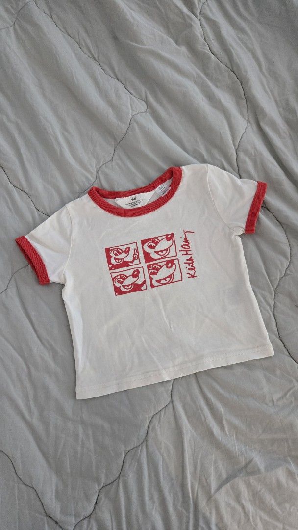 H&M Keith Haring Mickey Mouse T-shirt (Category: Babies & Kids Fashion) located in Quezon City. Submitted by wikimamad (Listing ID 1418832089, Image 1). Description: - H&M T-shirt - Features a Keith Haring design with Mickey Mouse - White with red trim - Crew neck and short sleeves - Size: 2-3 years - Graphic print on the front.