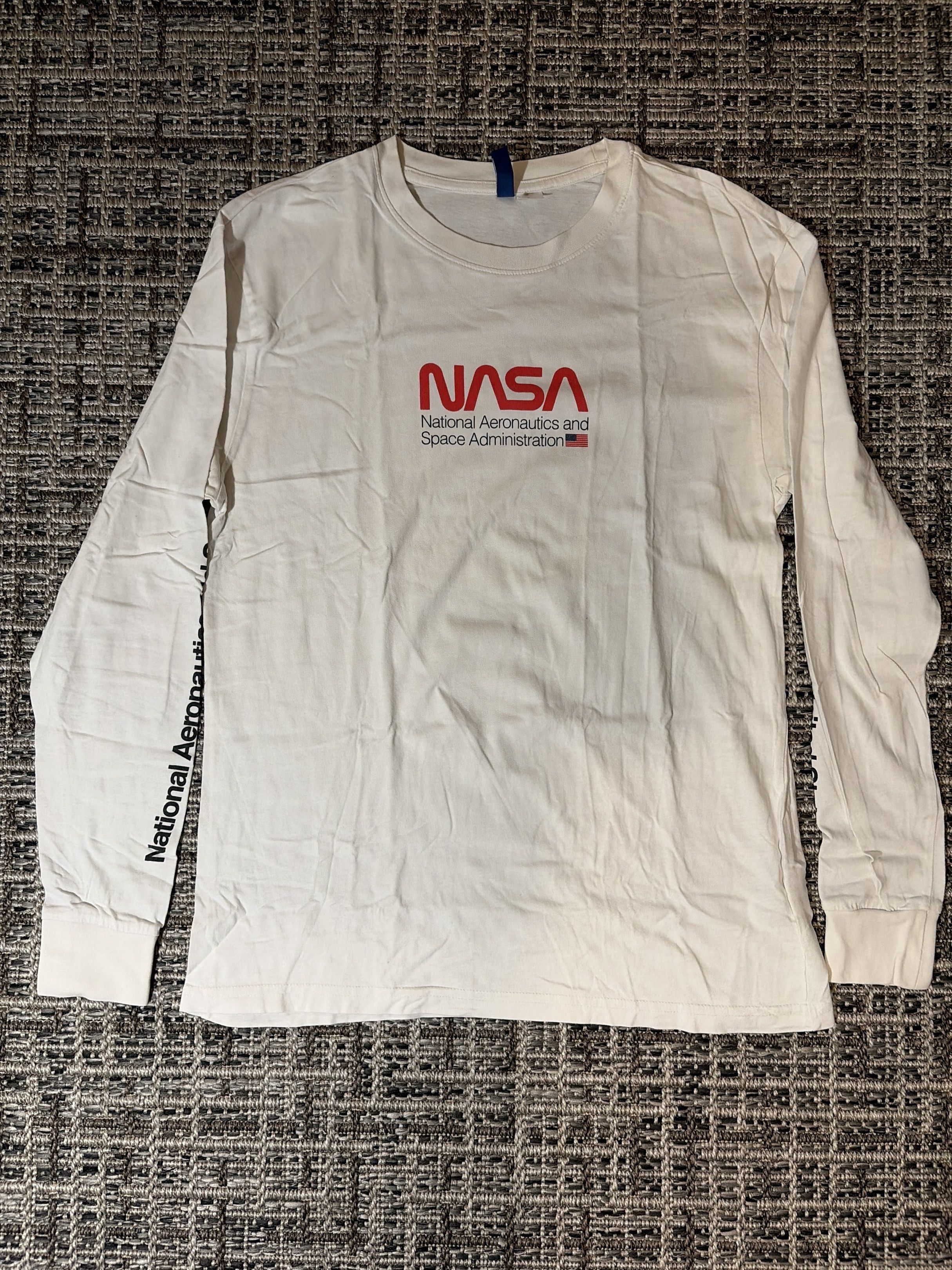 H&M NASA Long Sleeve Shirt (Category: Tshirts & Polo Shirts ) located in Manila. Submitted by enzoic (Listing ID 1418890318, Image 1). Description: - NASA logo also printed on the left sleeve - Size visible in the image.