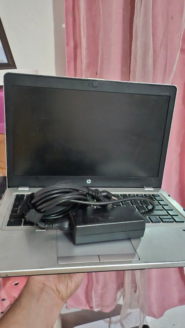 HP EliteBook 8460p Laptop (Category: Laptops & Notebooks) located in Valenzuela. Submitted by leviathan99 (Listing ID 1418907579, Image 1). Description: HP EliteBook 8460p laptop with charger. The screen displays Windows 10 Pro. The keyboard and trackpad are visible. The laptop has a silver finish. The specifications include an Intel Core i5-2520M CPU, 8GB RAM, and a 120GB hard drive. There are some issues but still working..
