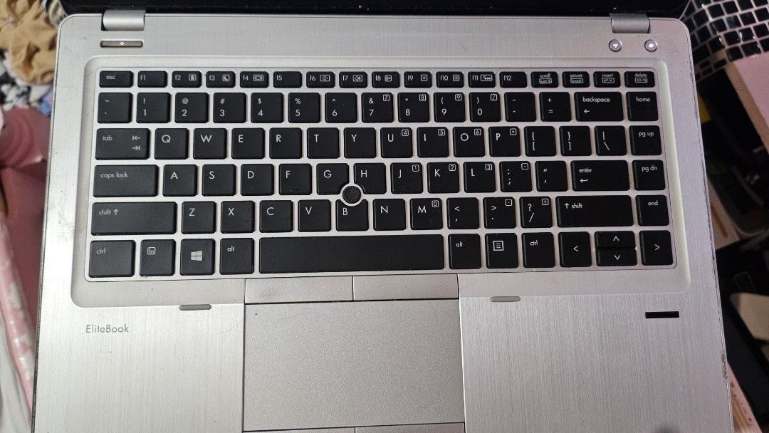 HP EliteBook 8460p Laptop (Category: Laptops & Notebooks) located in Valenzuela. Submitted by leviathan99 (Listing ID 1418907579, Image 3). Description: HP EliteBook 8460p laptop with charger. The screen displays Windows 10 Pro. The keyboard and trackpad are visible. The laptop has a silver finish. The specifications include an Intel Core i5-2520M CPU, 8GB RAM, and a 120GB hard drive. There are some issues but still working..