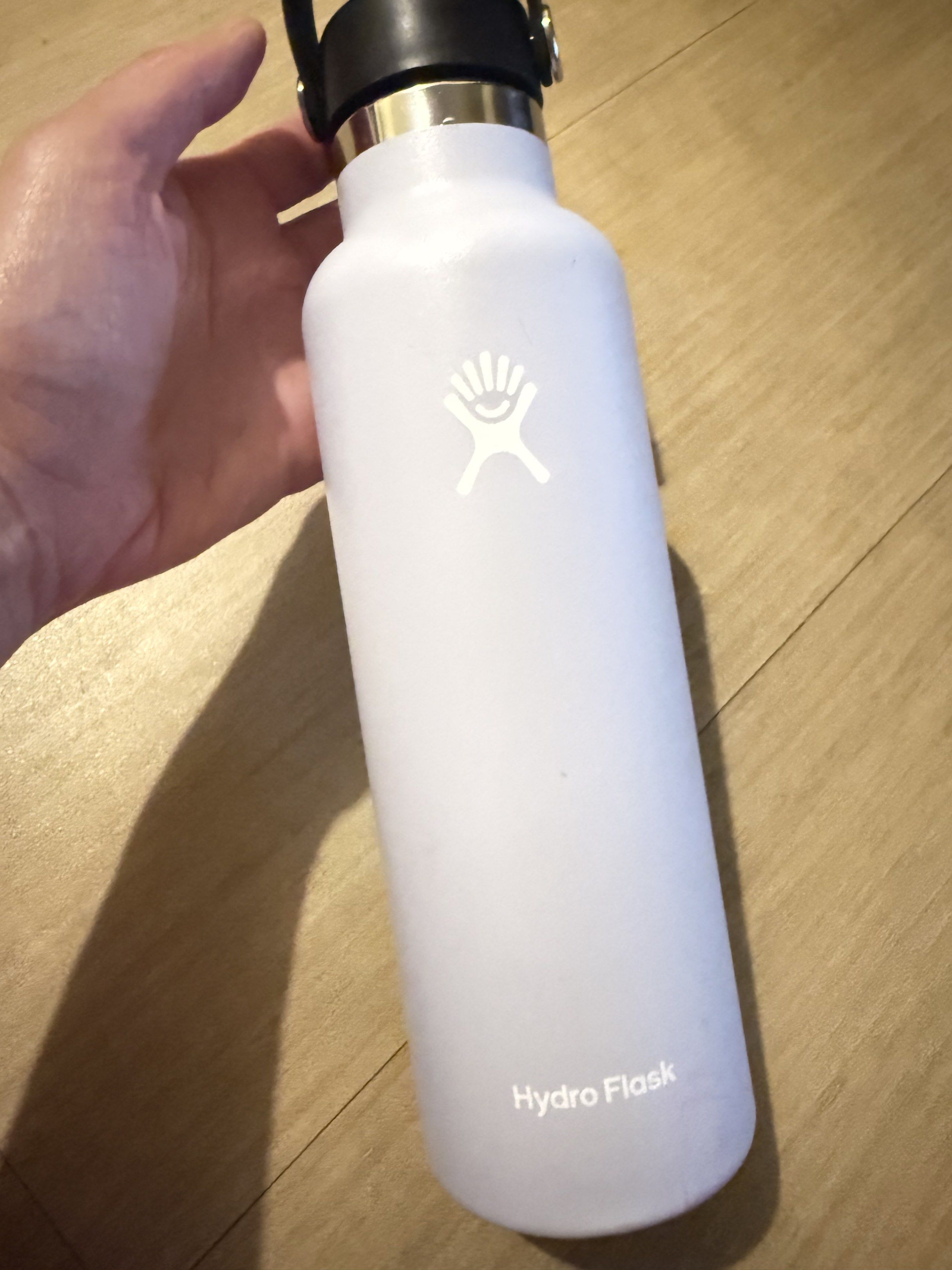 Hydro Flask 21oz Standard Mouth Water Bottle (Category: Water Bottles & Tumblers) located in Manila. Submitted by justbagit2 (Listing ID 1418946113, Image 1). Description: - Hydro Flask 21oz Standard Mouth water bottle - White body with black flex cap - BPA-free cap - Hydro Flask logo and product info on the bottom - Designed in Bend, OR - Made in China.