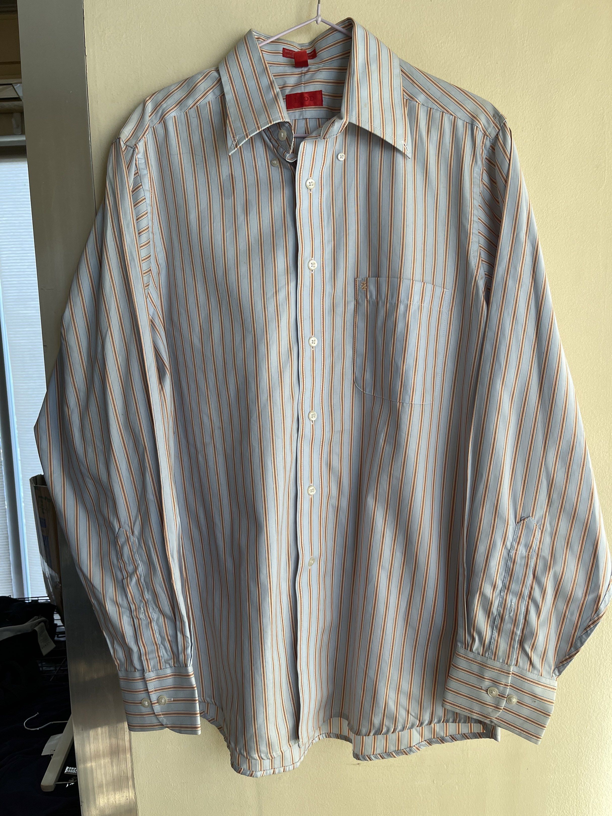 IZOD Striped Button-Down Shirt - Medium (Category: Tshirts & Polo Shirts ) located in Quezon City. Submitted by k.closetphp (Listing ID 1418856785, Image 1). Description: - IZOD button-down shirt - Striped pattern - Classic collar and long sleeves - Size: Medium - Material: 80's 2-ply pinpoint cotton - Features a chest pocket - 'Easy Care' label - Made in Bangladesh.