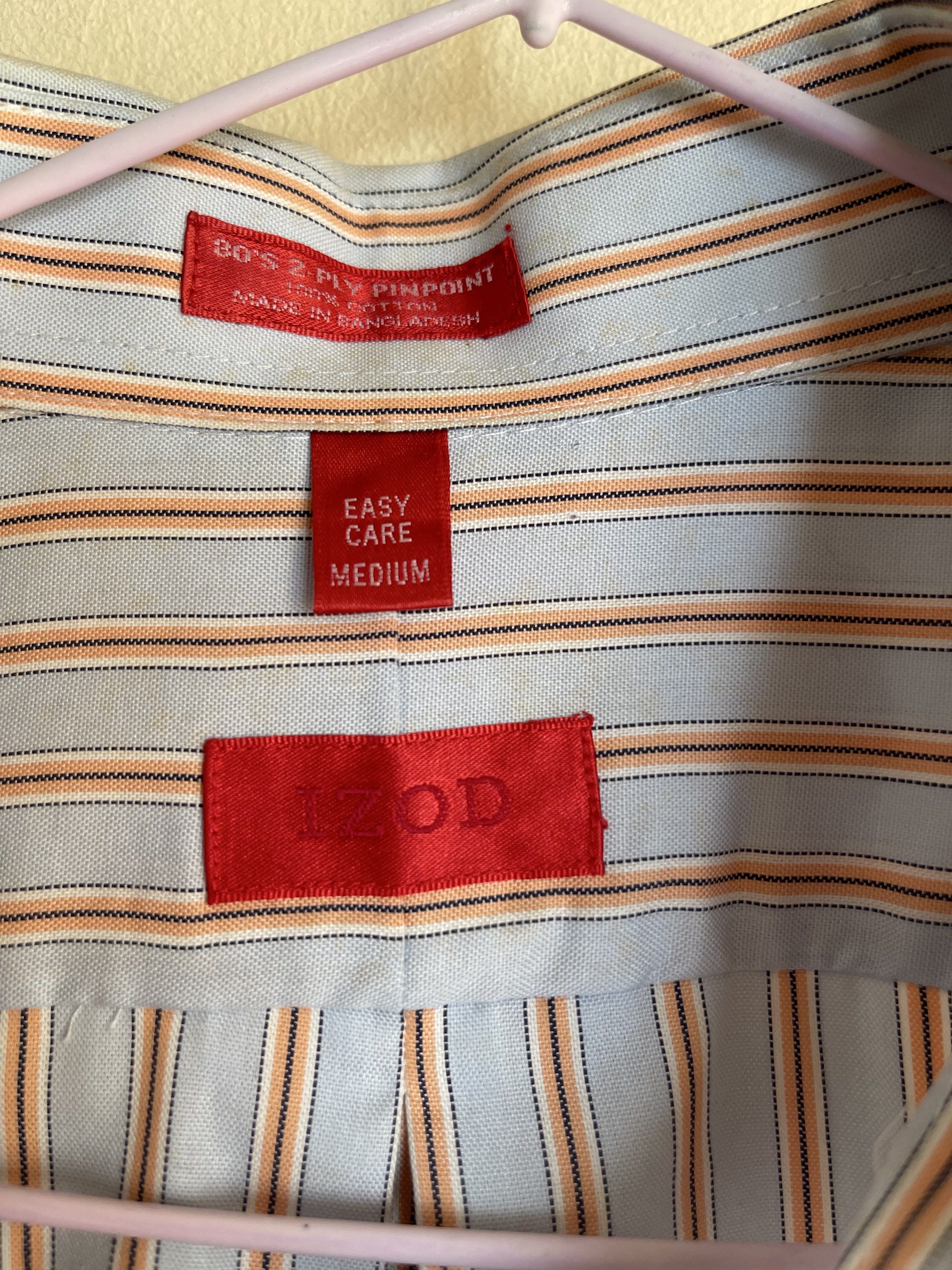 IZOD Striped Button-Down Shirt - Medium (Category: Tshirts & Polo Shirts ) located in Quezon City. Submitted by k.closetphp (Listing ID 1418856785, Image 2). Description: - IZOD button-down shirt - Striped pattern - Classic collar and long sleeves - Size: Medium - Material: 80's 2-ply pinpoint cotton - Features a chest pocket - 'Easy Care' label - Made in Bangladesh.