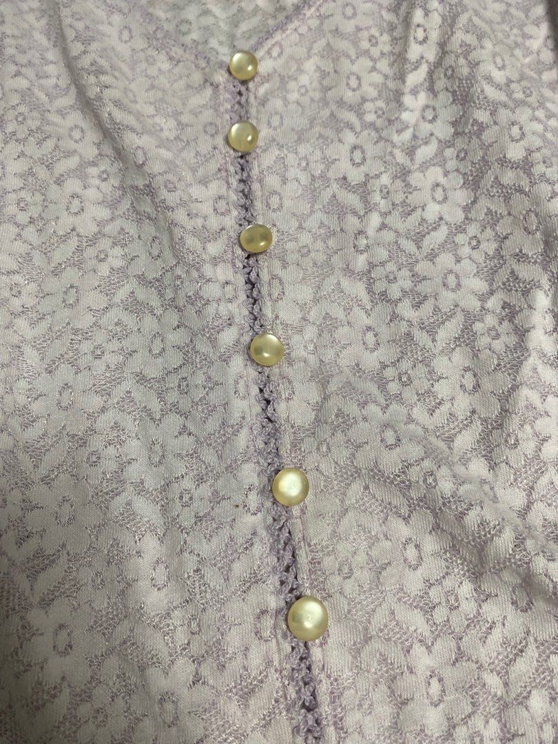 Lilac Floral Lace Button-Up Top (Category: Blouses) located in Calamba. Submitted by curse.thin_ (Listing ID 1418780292, Image 2). Description: - Lavender floral print top - V-neckline - Short sleeves - Button-down front - Lightweight fabric - Ideal for warm weather.