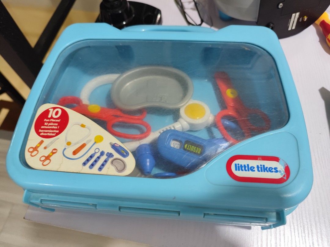 Doctors Toy (Category: Infant Playtime) located in Manila. Submitted by pctiu (Listing ID 1418783314, Image 1). Description: - Little Tikes Doctor Kit - Includes a blue carrying case - Features all original medical tools: - Stethoscope - Scissors - Thermometer - And more! - Case color: Light blue with clear top - Tool colors: Red, blue, yellow, and more.