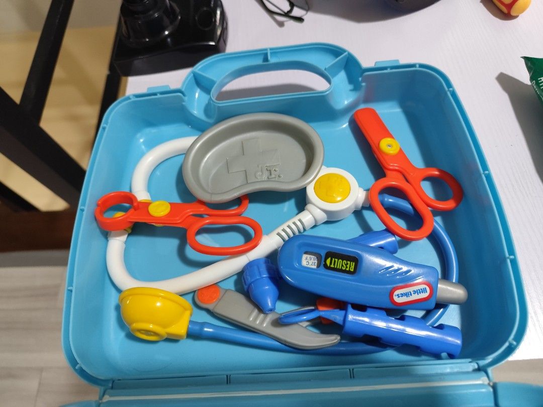 Doctors Toy (Category: Infant Playtime) located in Manila. Submitted by pctiu (Listing ID 1418783314, Image 2). Description: - Little Tikes Doctor Kit - Includes a blue carrying case - Features all original medical tools: - Stethoscope - Scissors - Thermometer - And more! - Case color: Light blue with clear top - Tool colors: Red, blue, yellow, and more.