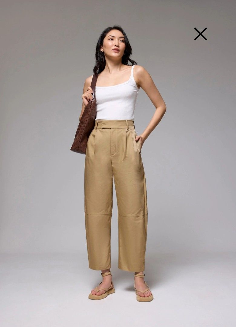 Love Bonito Wide Leg Pants (Category: Other Bottoms) located in Manila. Submitted by tororo97 (Listing ID 1418940063, Image 1). Description: - Tan wide-leg pants - High-waisted with pleats - Features side pockets - Relaxed fit - Cropped at the ankle - Lightweight fabric, perfect for warm weather.