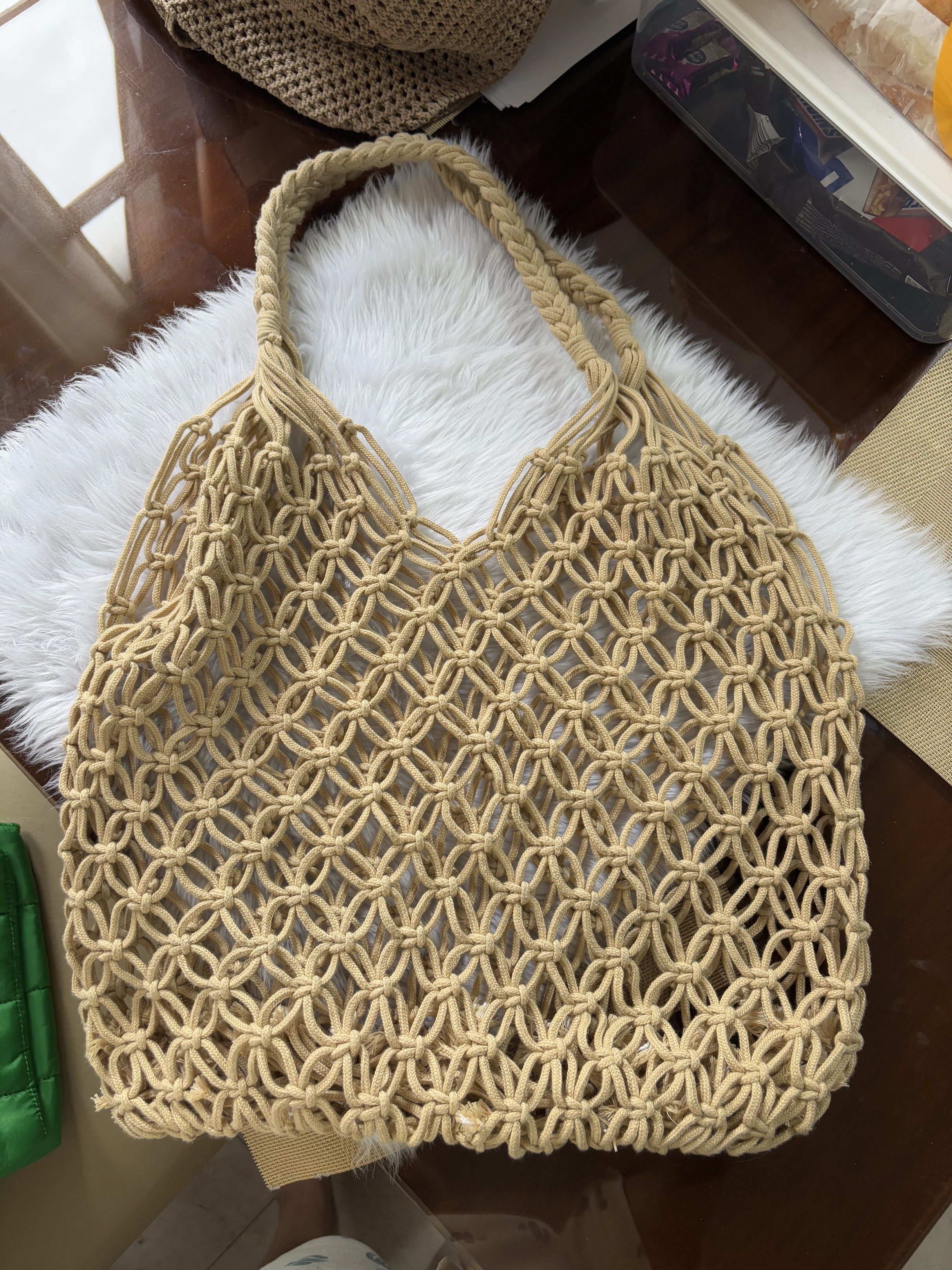 Macrame Tote Bag (Category: Tote Bags) located in Pasig City. Submitted by Declutterwithme0831 (Listing ID 1418819283, Image 1). Description: - Beige macrame tote bag - Woven design - Braided handles - Versatile for any outfit - Perfect for everyday use.