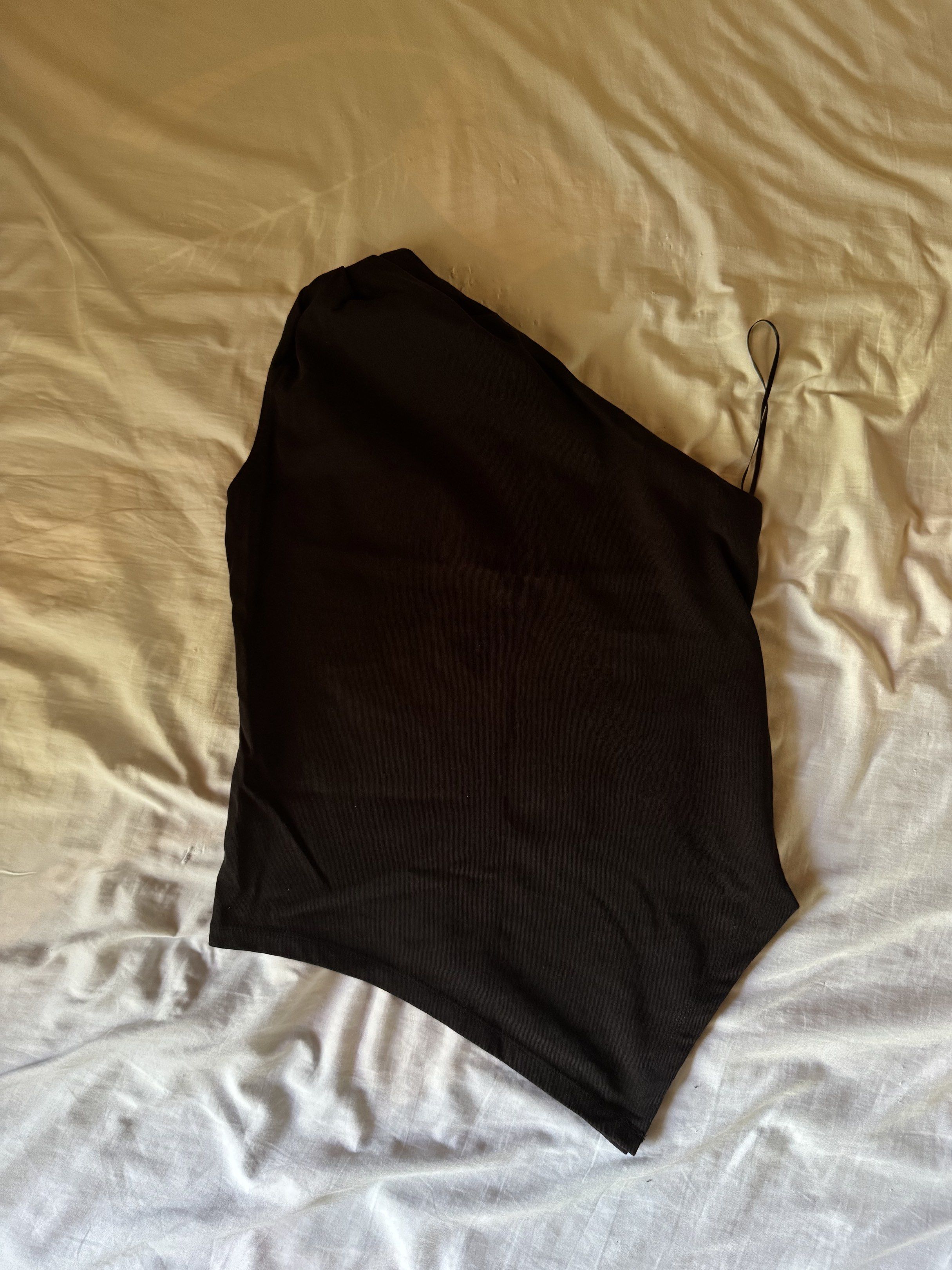 Mango Asymmetrical Top (Category: Sleeveless) located in Glan. Submitted by softgasps (Listing ID 1418785325, Image 2). Description: - Used only once. Like new - Pristine, no flaws - size xs, black color - Bought on mango online - Ships from mindanao.