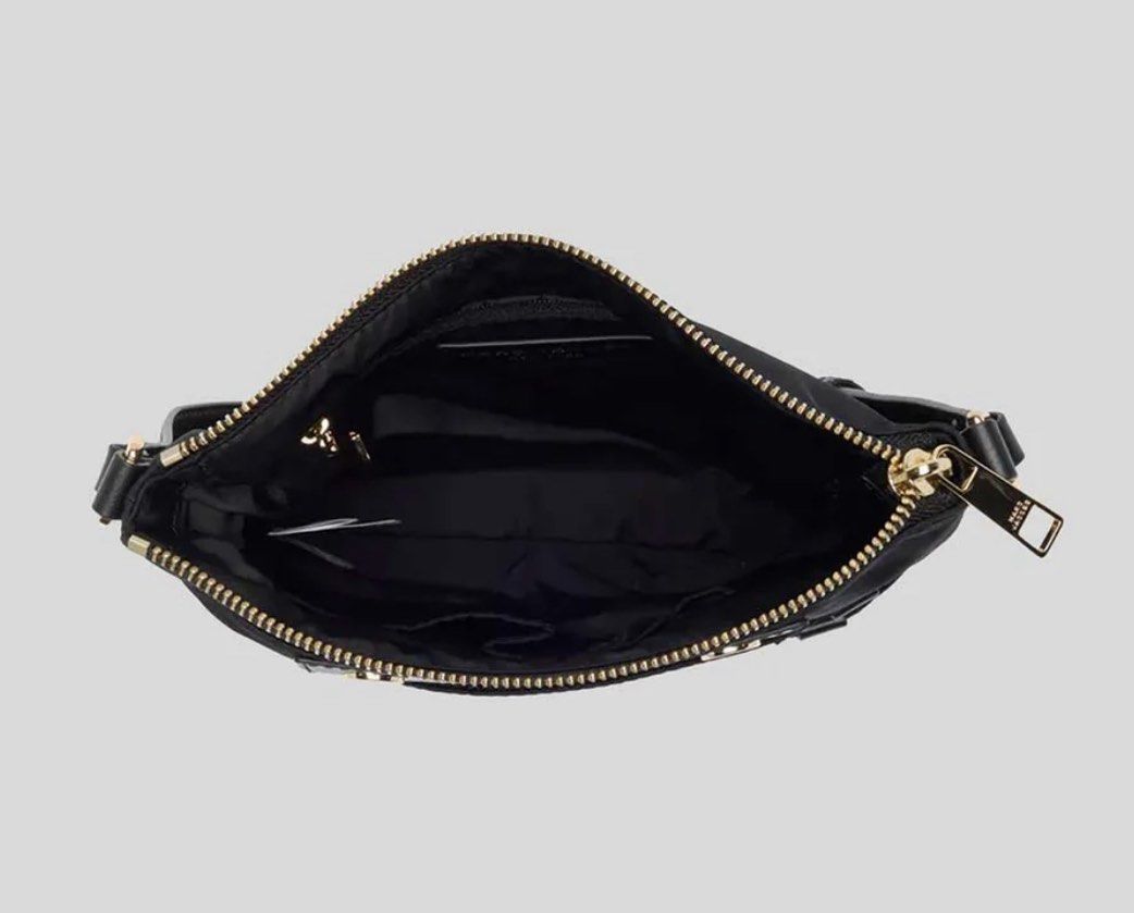 Marc Jacobs Preppy Swing Pack Crossbody Bag (Category: Luxury Bags & Wallets) located in Manila. Submitted by jcmph (Listing ID 1418793406, Image 3). Description: Marc Jacobs Preppy Swing Pack crossbody bag is black and features a top zip closure. It has a polyester material with polyurethane trim. The bag includes a strap and multiple pockets. It comes with tags and original packaging. The bag's dimensions are approximately 9 1/2" H x 9" W x 1 1