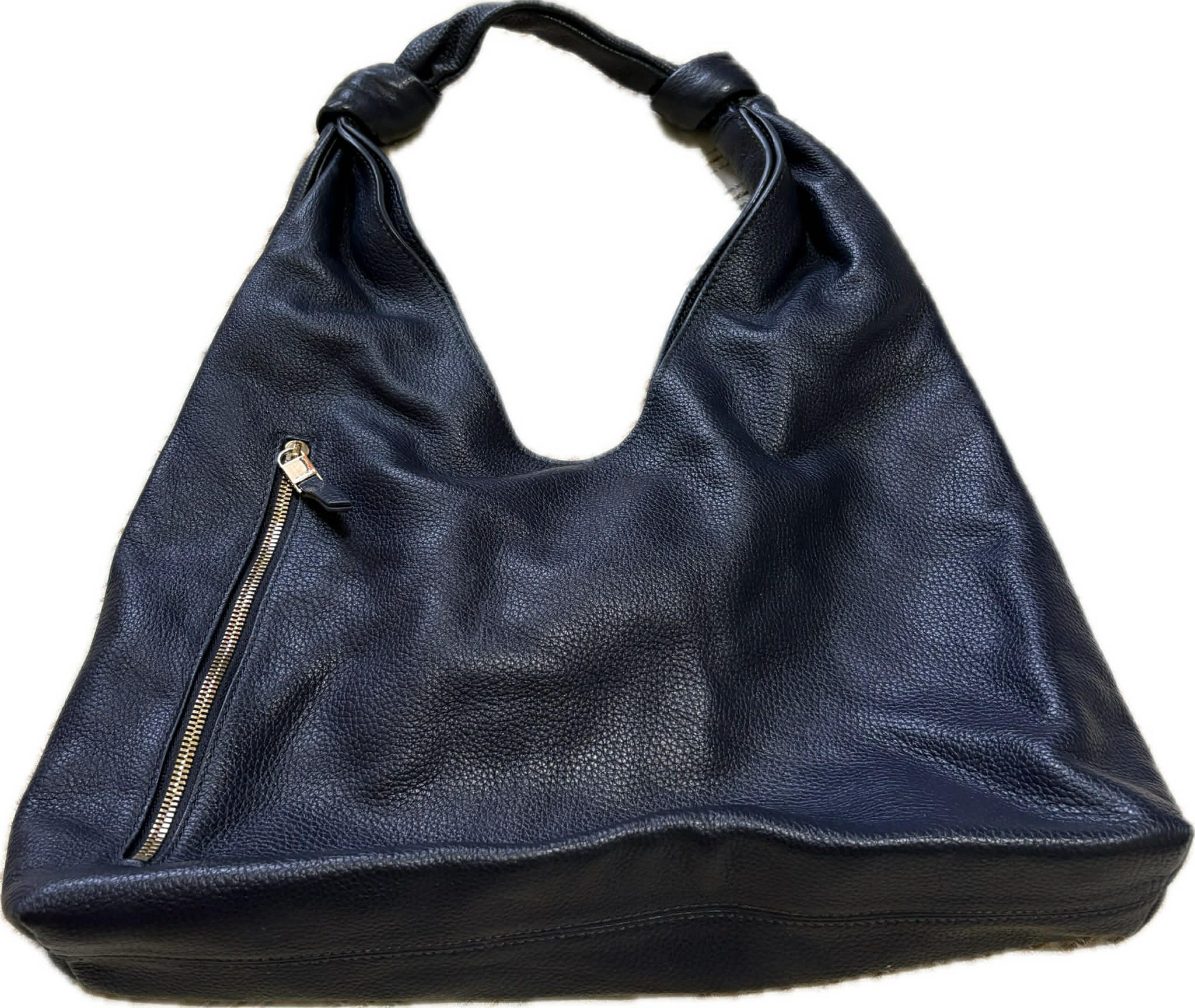 Marie Claire Leather Hobo Bag (Category: Shoulder Bags) located in Arakan. Submitted by mangaroo (Listing ID 1418798077, Image 1). Description: - LAST PRICE + SF - midnight blue hobo bag - Knotted handle - Zippered pocket with gold-colored pull - Textured surface - Spacious interior - Single shoulder strap - Leather material.