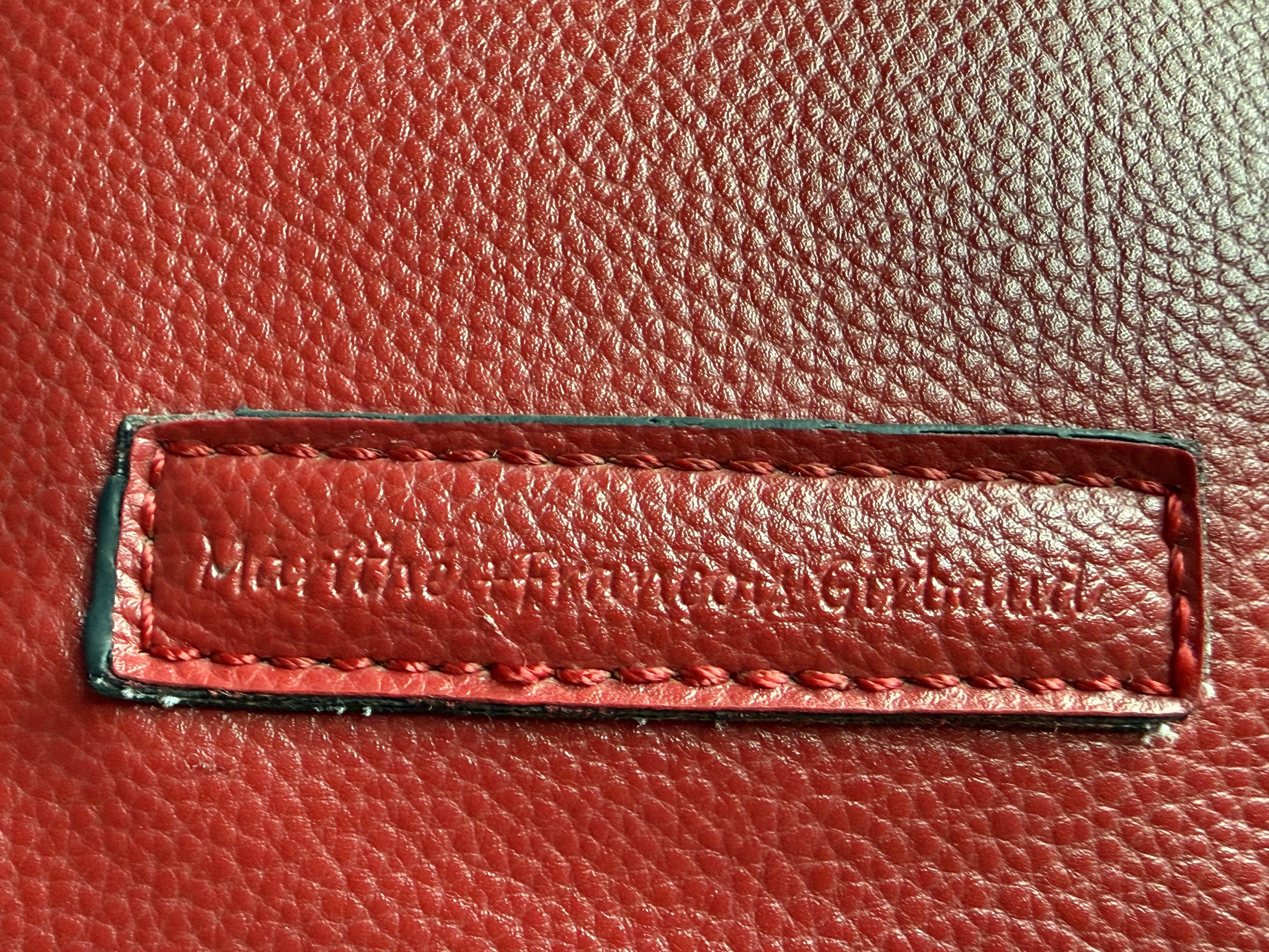 Marithe Francois Girbaud Red Handbag (Category: Luxury Bags & Wallets) located in Makati City. Submitted by SariSariKung_AnuAno (Listing ID 1418976282, Image 3). Description: - Marithe Francois Girbaud red handbag - Top handle and detachable shoulder strap - Secure zipper closure - Comfortable fabric lining - Decorative stitching - Minor wear on handle and corners - Includes small brand tag - not leather, synthetic material All flaws shown in the