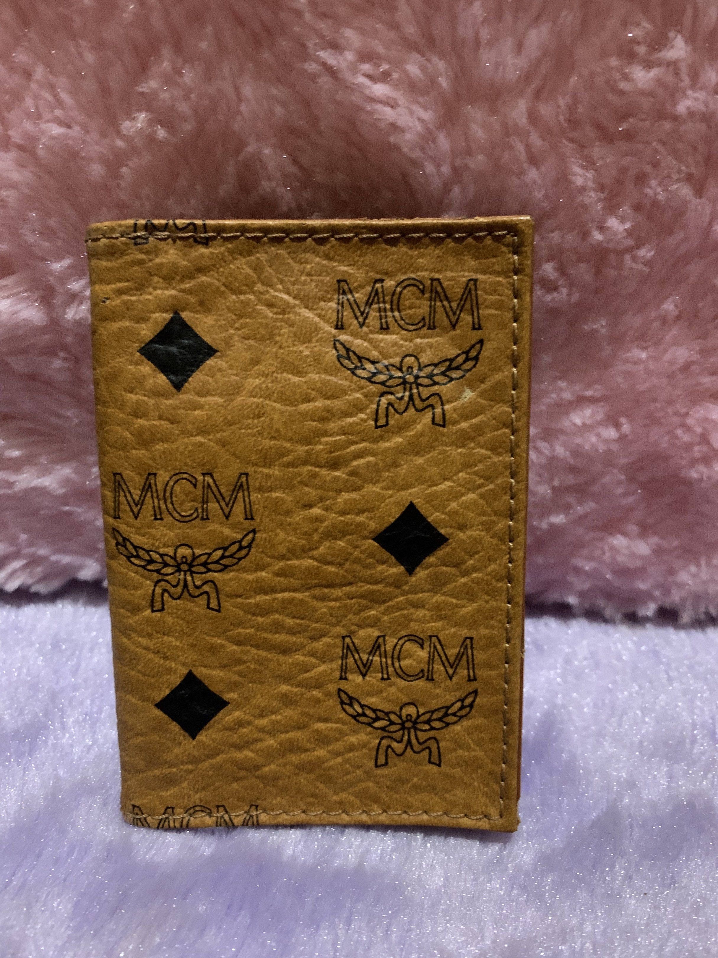 MCM Card Holder (Category: Luxury Bags & Wallets) located in Quezon City. Submitted by ncjnc (Listing ID 1418925739, Image 2). Description: - Authentic MCM card holder - Features MCM logo and diamond pattern - Includes photo slot - Includes card slot - Made in Germany - Color: Brown.