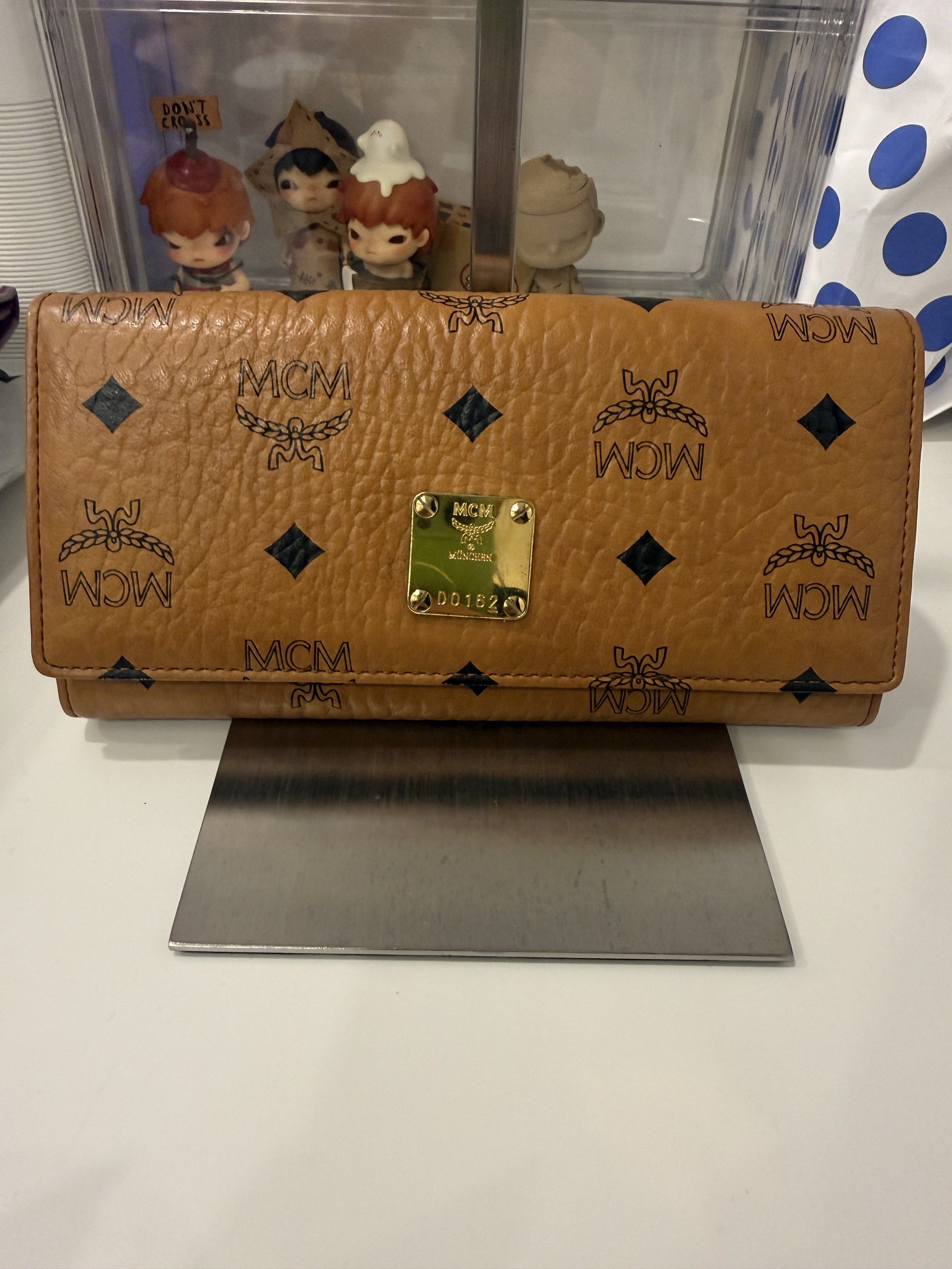 MCM Cognac Visetos Trifold (Category: Luxury Bags & Wallets) located in Pasay City. Submitted by wanabruce820 (Listing ID 1418930699, Image 1). Description: Trifold Leather Long Snap Flap Wallet Can put sling chain to become WOC .