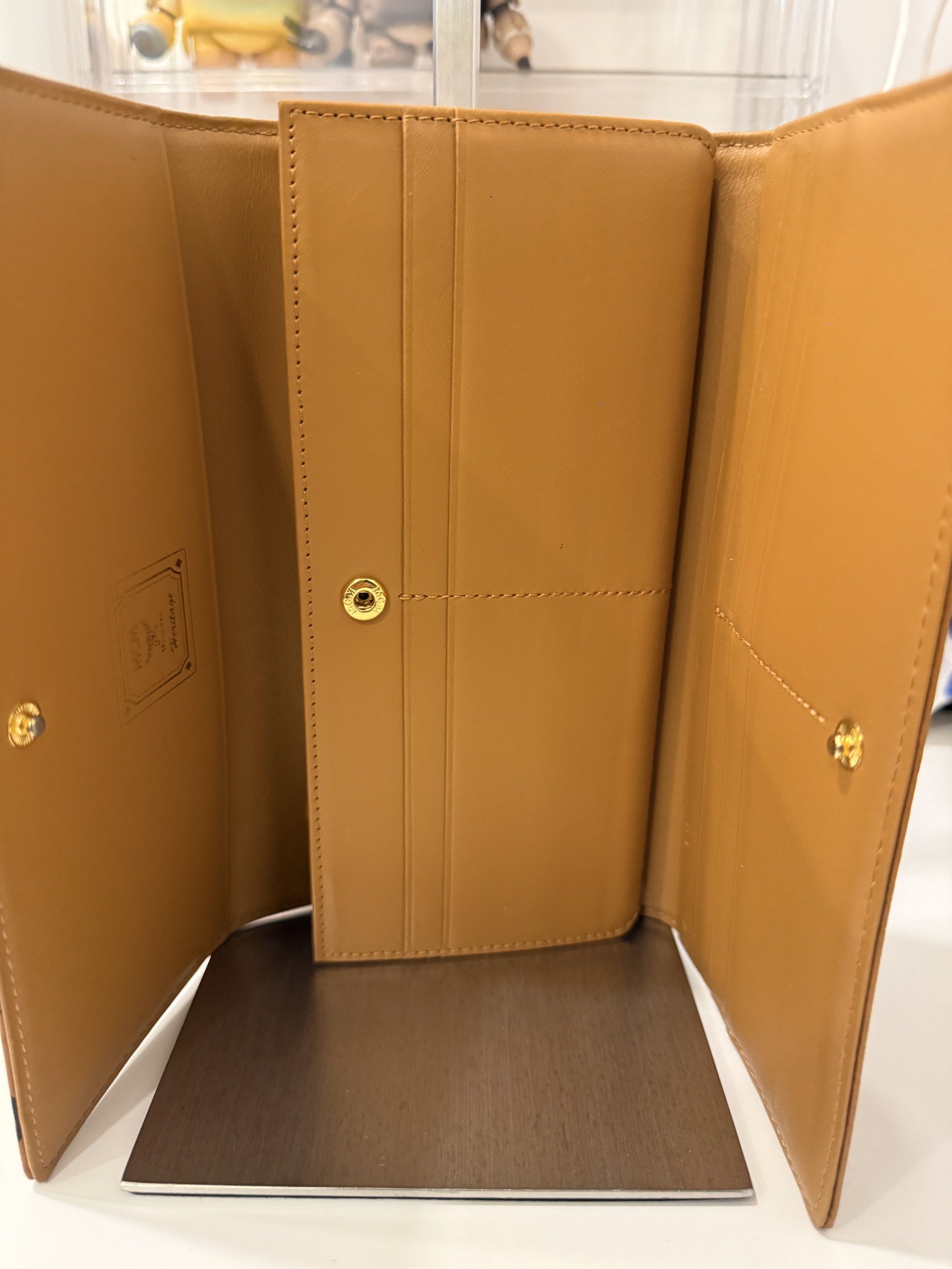 MCM Cognac Visetos Trifold (Category: Luxury Bags & Wallets) located in Pasay City. Submitted by wanabruce820 (Listing ID 1418930699, Image 3). Description: Trifold Leather Long Snap Flap Wallet Can put sling chain to become WOC .