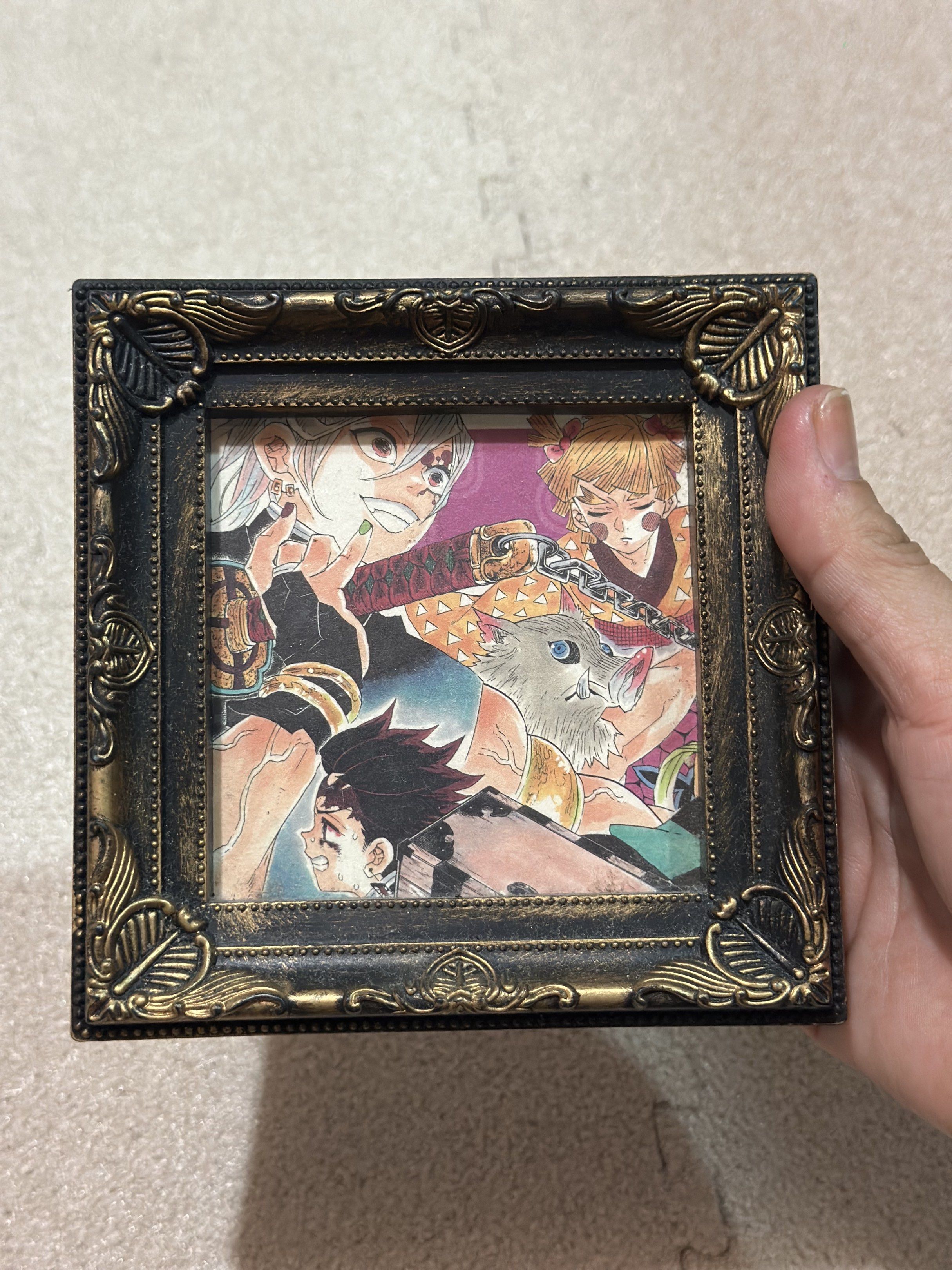 Mini photo frame with demon slayer art (Category: Frames & Pictures) located in Davao. Submitted by favoritepreloved (Listing ID 1418894590, Image 1). Description: ❤️ 12cm x 12cm.