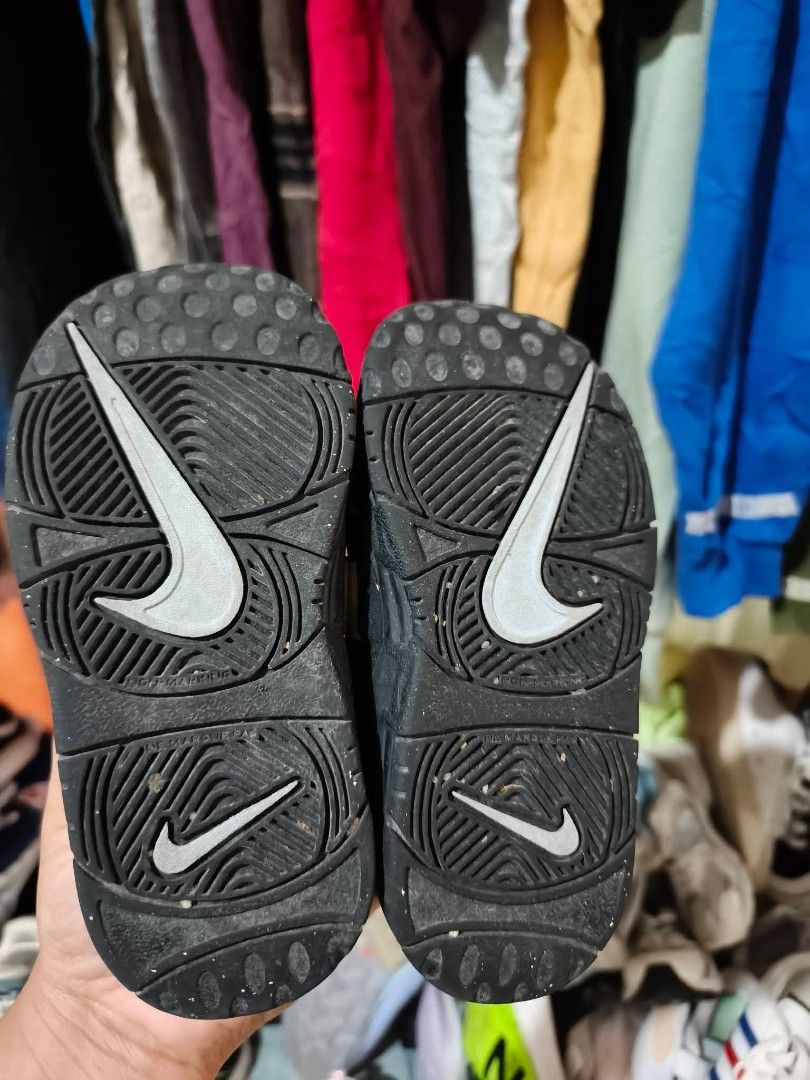 Nike Air More Uptempo Toddler Sneakers (Category: Babies & Kids Fashion) located in Baguio. Submitted by jasminmangusan (Listing ID 1418893473, Image 3). Description: - Authentic Nike Air More Uptempo toddler sneakers - Size: 8C - Colorway: Black, white, and light blue - Features the iconic "AIR" branding on the sides - Black sole - White and black upper - Nike logo on soles.