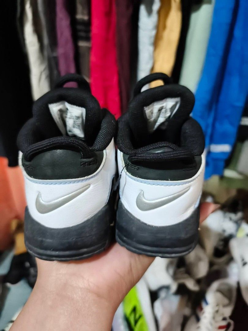 Nike Air More Uptempo Toddler Sneakers (Category: Babies & Kids Fashion) located in Baguio. Submitted by jasminmangusan (Listing ID 1418893473, Image 2). Description: - Authentic Nike Air More Uptempo toddler sneakers - Size: 8C - Colorway: Black, white, and light blue - Features the iconic "AIR" branding on the sides - Black sole - White and black upper - Nike logo on soles.