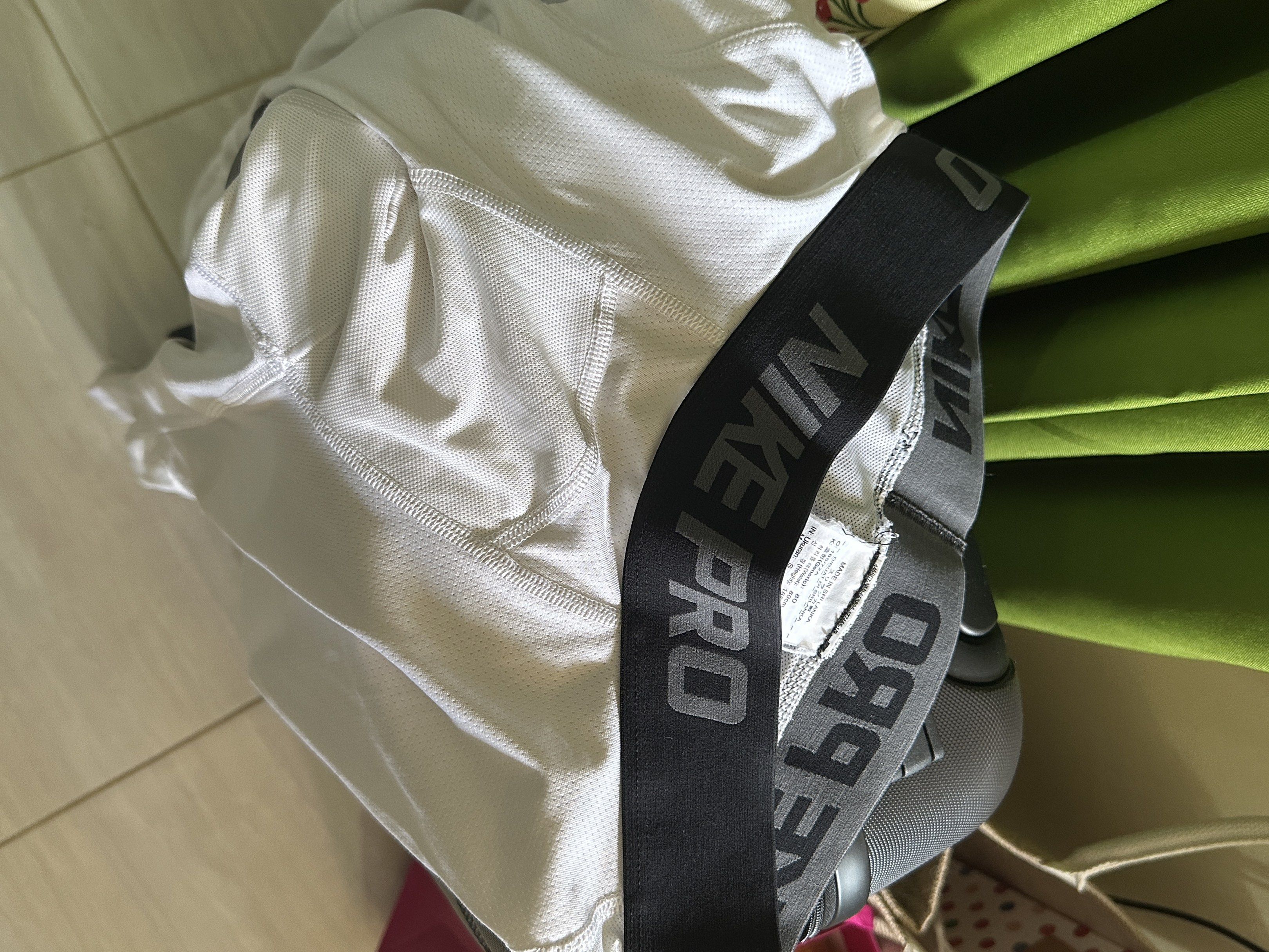 Nike Pro White Mens Dri-Fit Compression (Category: Activewear) located in Davao. Submitted by bydonbu (Listing ID 1418838044, Image 2). Description: - Nike Pro 3/4 leggings - Color: White - Black waistband with Nike Pro logo - Nike swoosh logo on leg - Made of breathable, athletic material - Perfect for workouts and casual wear - Used for basketball - No issues.