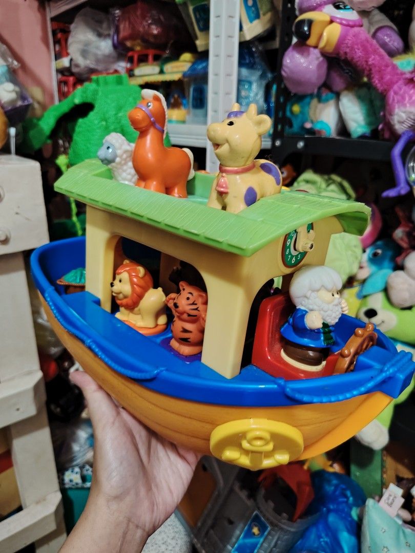 Noah's Ark Musical Toy (Category: Educational & Learning Toys) located in Iligan City. Submitted by shehabdor98515 (Listing ID 1418971201, Image 3). Description: - Musical Noah's Ark toy - Includes animal figures: horse, sheep, cow, lion, and tiger - Missing one pig figure - Ark features: - Green roof - Clock detail - Noah figure.