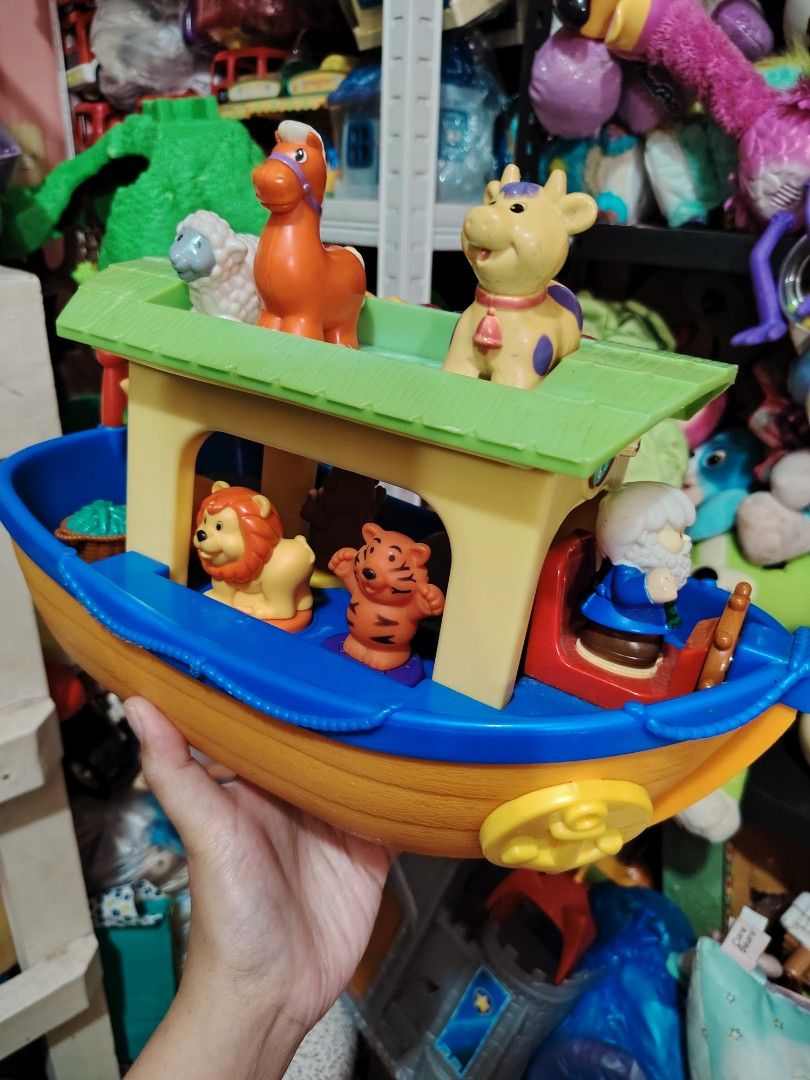 Noah's Ark Musical Toy (Category: Educational & Learning Toys) located in Iligan City. Submitted by shehabdor98515 (Listing ID 1418971201, Image 2). Description: - Musical Noah's Ark toy - Includes animal figures: horse, sheep, cow, lion, and tiger - Missing one pig figure - Ark features: - Green roof - Clock detail - Noah figure.