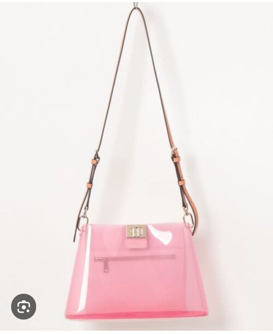 Orig Furla Pink Transparent Bag (Category: Luxury Bags & Wallets) located in Caloocan City. Submitted by guiltypleasures75 (Listing ID 1418874988, Image 1). Description: - Furla shoulder bag (Bawal sa maselan) - Pink color - Transparent body - Top handle - Detachable shoulder strap - Metal clasp - Pink interior - Made in China issue- penmark sa gilid ng bag.you can clean it with dishwasing liquid,vinegar and water Or you can put stuff keychain to