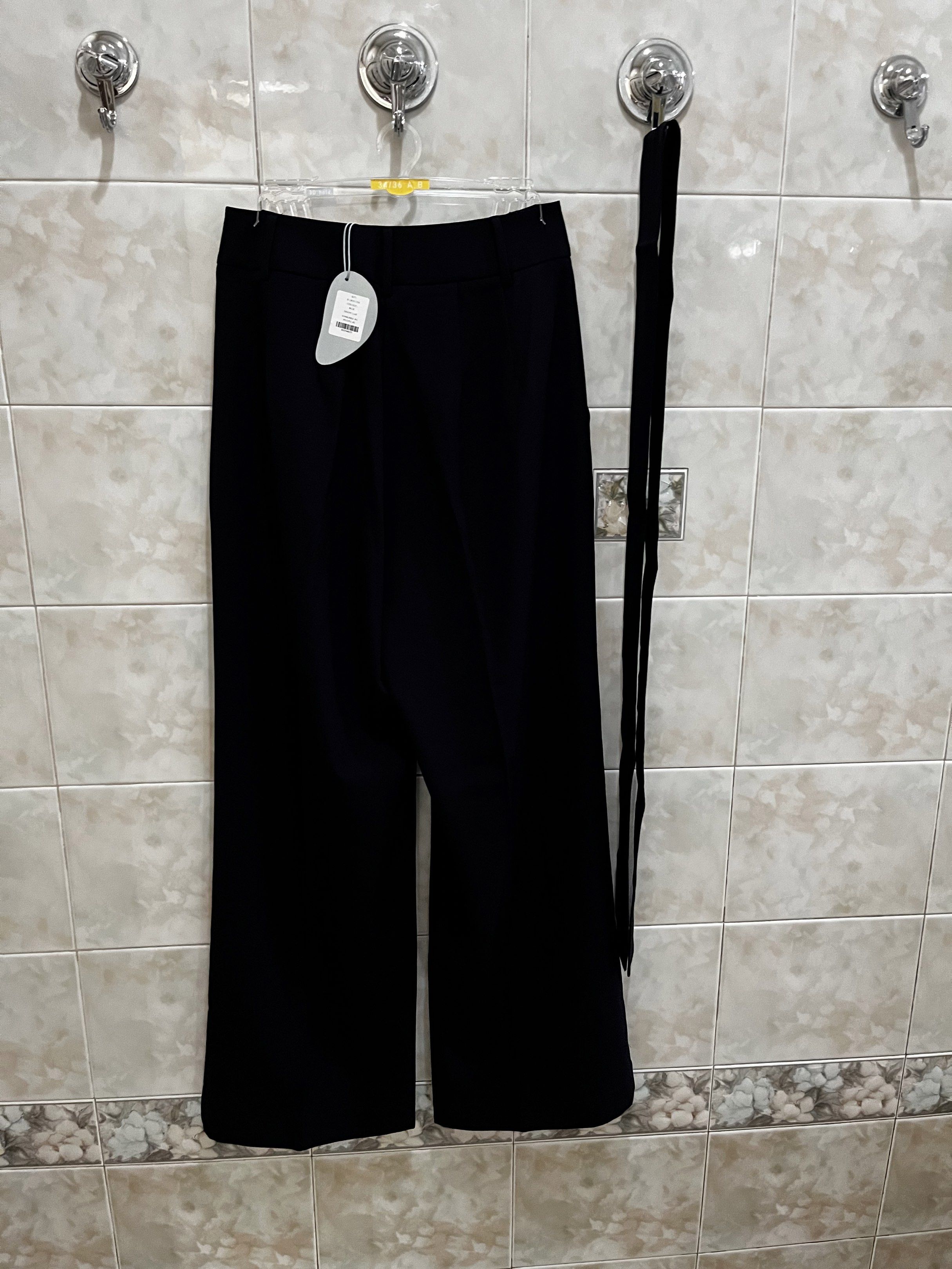 Our Second Nature Navy Blue Wide Leg Pants (Category: Other Bottoms) located in Manila. Submitted by jcmph (Listing ID 1418846449, Image 2). Description: - Our Second Nature wide-leg pants - Size: S - Material: 100% polyester - Features a matching blue tie - Classic design - New with tags Waist 27 inches Length 39 inches.