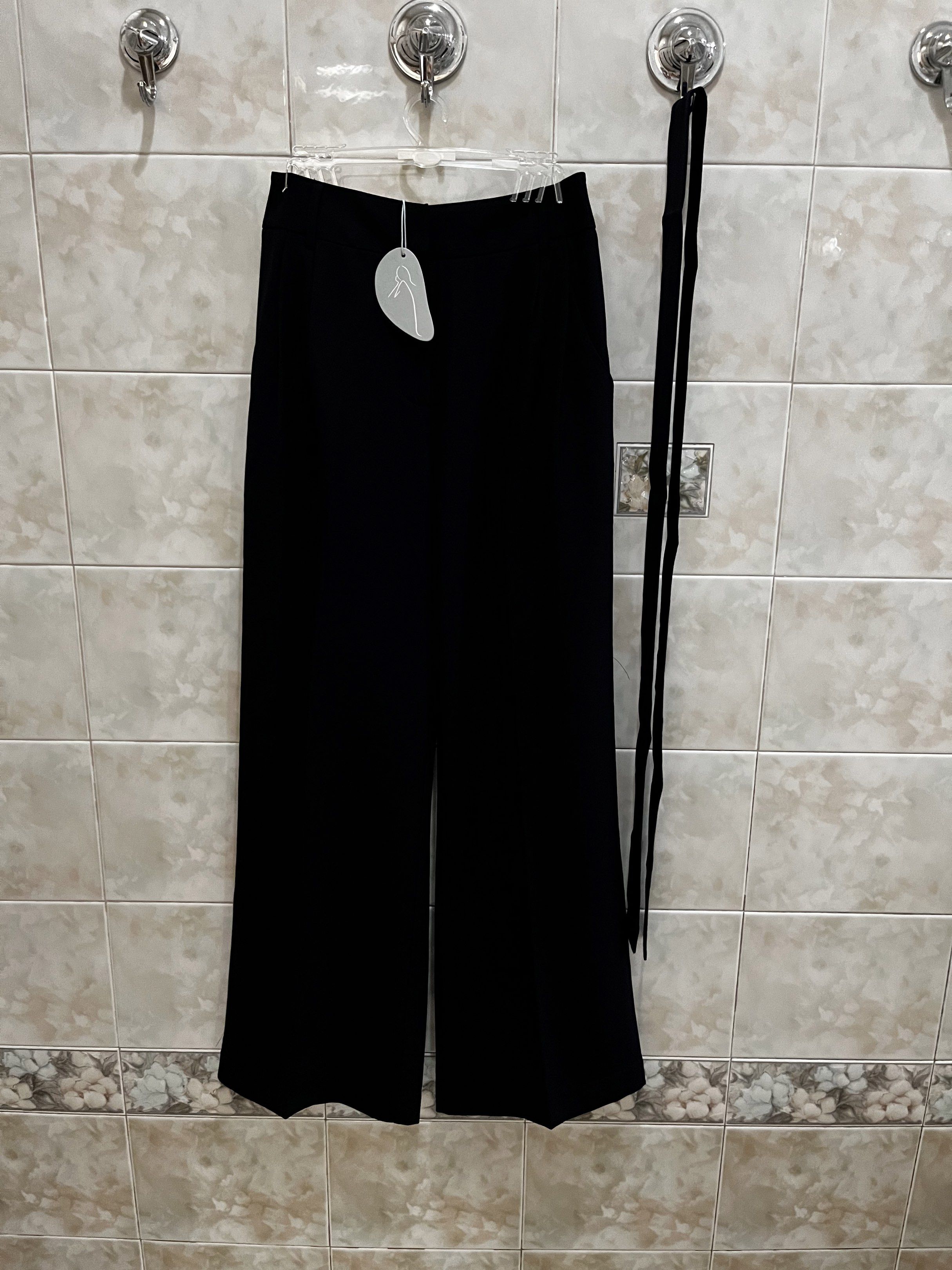 Our Second Nature Navy Blue Wide Leg Pants (Category: Other Bottoms) located in Manila. Submitted by jcmph (Listing ID 1418846449, Image 1). Description: - Our Second Nature wide-leg pants - Size: S - Material: 100% polyester - Features a matching blue tie - Classic design - New with tags Waist 27 inches Length 39 inches.