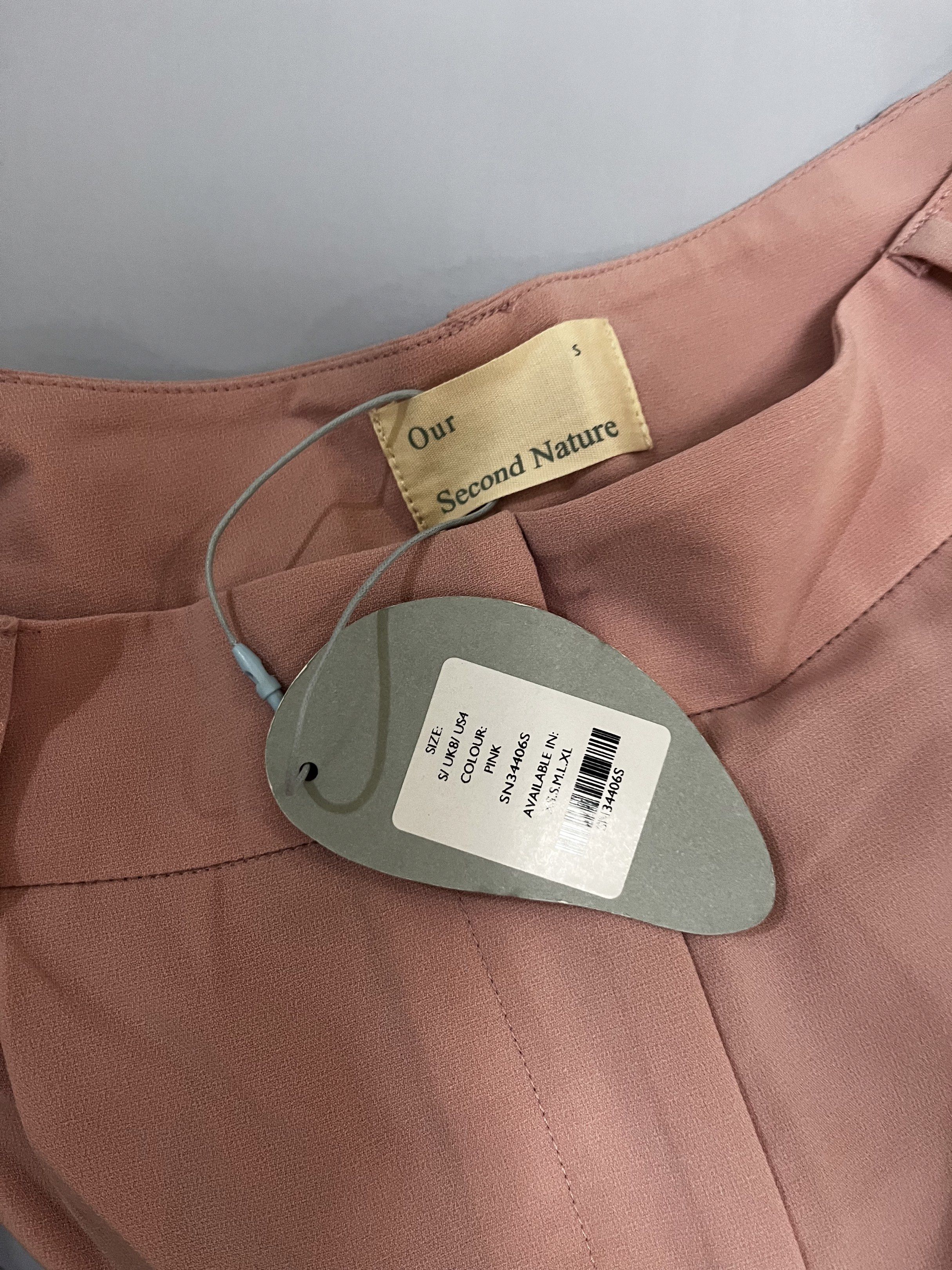 Our Second Nature Pink Wide Leg Pants (Category: Other Bottoms) located in Manila. Submitted by jcmph (Listing ID 1418846814, Image 3). Description: - Our Second Nature pink wide-leg pants - Size S - Includes matching belt - New with tag - Made of 100% polyester - Classic design Waist 27 inches Length 39 inches .