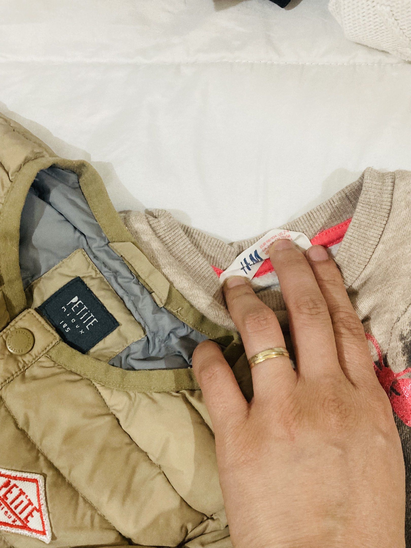 Petite Jacket and H&M Sweatshirt bundle (Category: Babies & Kids Fashion) located in La Trinidad. Submitted by secondsmatter (Listing ID 1418902586, Image 2). Description: - Petite light brown quilted jacket (excellent condition) - H&M beige sweatshirt with deer graphic and round neck (with signs of usage) - Both items are for children..
