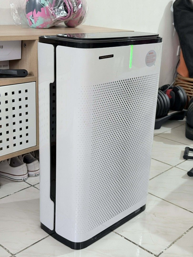 Pneumovent Air Purifier with HEPA Filter (Category: Air Purifiers & Dehumidifiers) located in Makati City. Submitted by jeanneguerrero (Listing ID 1411927288, Image 1). Description: - Pneumovent air purifier - White body with perforated design - Black trim - Well-used - Filter needs cleaning and two dead pixels but everything works as intended - Size: 15 x 8.5 x 25 - RFS: upgraded to another size - Price: 1,200.