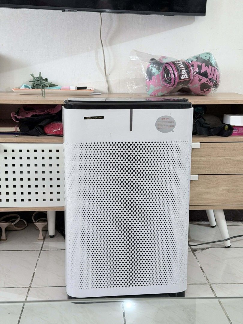 Pneumovent Air Purifier with HEPA Filter (Category: Air Purifiers & Dehumidifiers) located in Makati City. Submitted by jeanneguerrero (Listing ID 1411927288, Image 2). Description: - Pneumovent air purifier - White body with perforated design - Black trim - Well-used - Filter needs cleaning and two dead pixels but everything works as intended - Size: 15 x 8.5 x 25 - RFS: upgraded to another size - Price: 1,200.