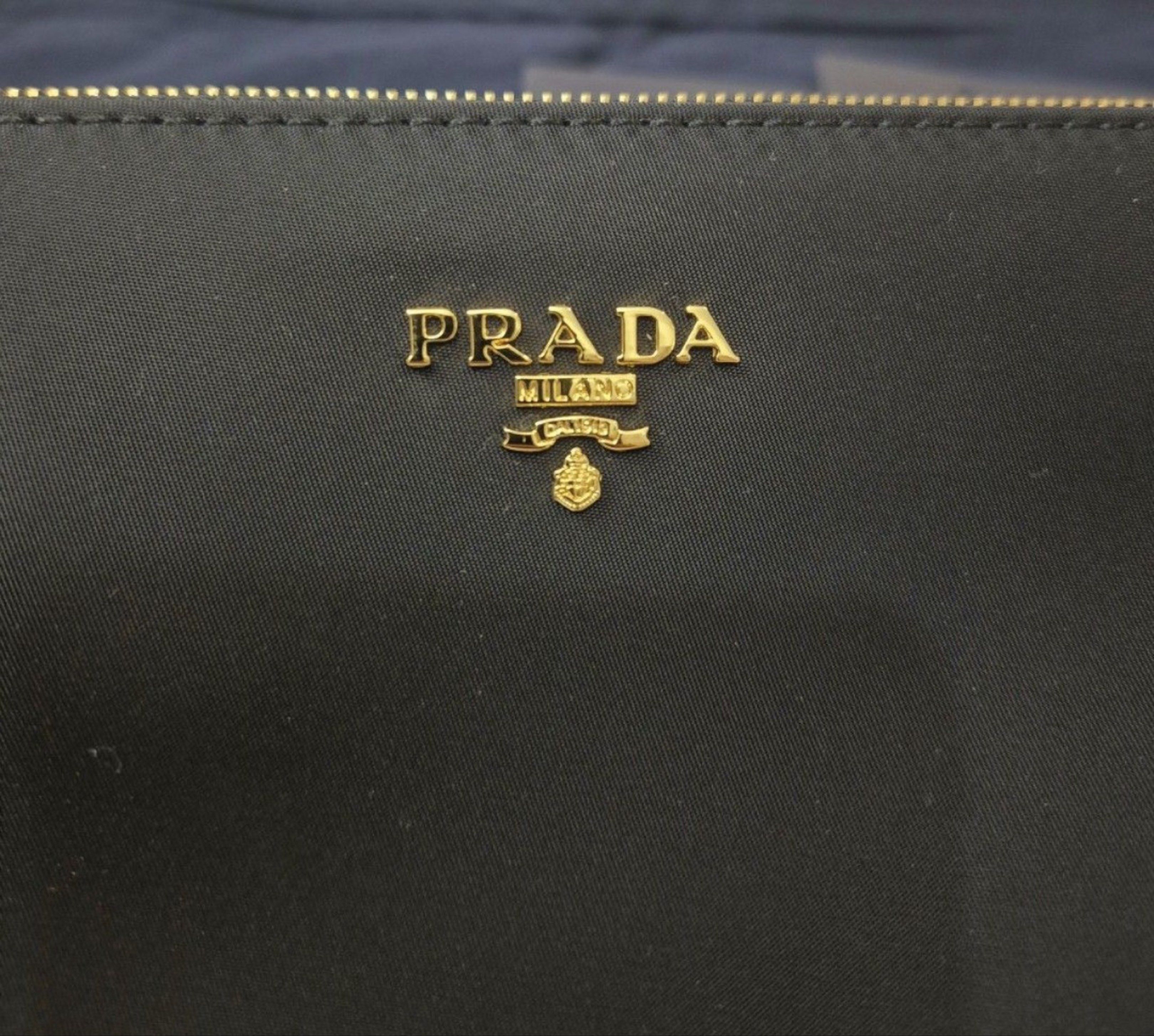 Prada Nylon Pochette (Category: Luxury Bags & Wallets) located in Manila. Submitted by iconvee (Listing ID 1418827927, Image 2). Description: LIKE NEW! Authentic Prada Nylon Pochette. 🔴 RFS: barely used. - msg for more questions/pics. - inclusions: orig dust bag, cards. MOD: gcash/BDO. strictly payment first. no layaway. SHIP: lalamove/j&t. buyers cover fee. .