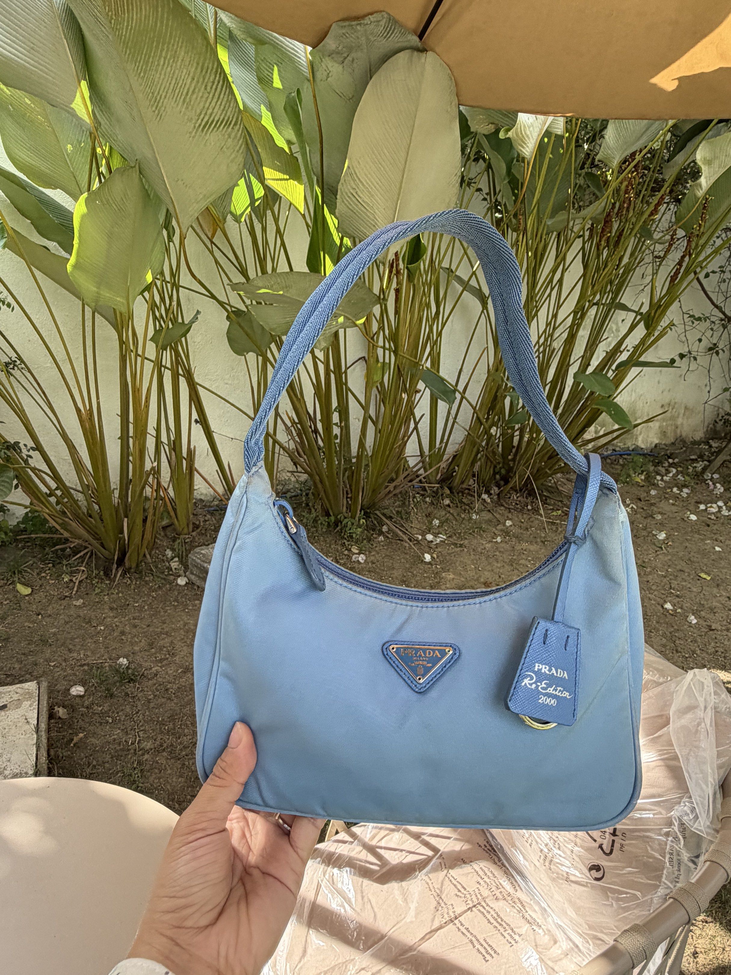 Prada Re-Edition 2000 Mini Bag - Baby Blue (Category: Luxury Bags & Wallets) located in Plaridel. Submitted by marquezdiane (Listing ID 1418842586, Image 2). Description: - Authentic Prada Re-Edition 2000 mini bag - Baby blue nylon exterior - Minimal signs of usage dirt matatanggal sa bagspa - Matching blue handle - Detachable leather tag - Prada Milano interior label - Zipper closure - Made in Italy - Includes original prada dustbag.