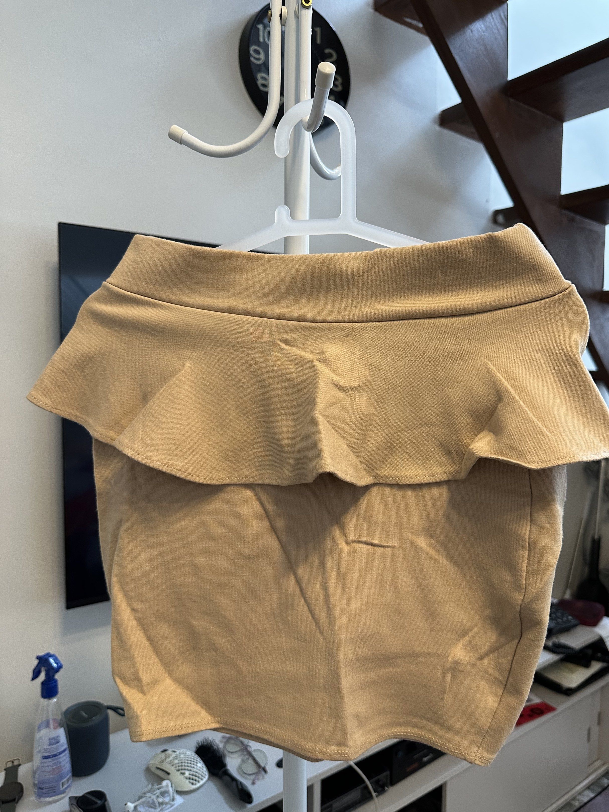Preloved Clothes (Category: Skirts) located in Makati City. Submitted by ideclutteritems.ph (Listing ID 1418798564, Image 1). Description: - Preloved skirt - Size: S - Color: Beige - Easy to pair.