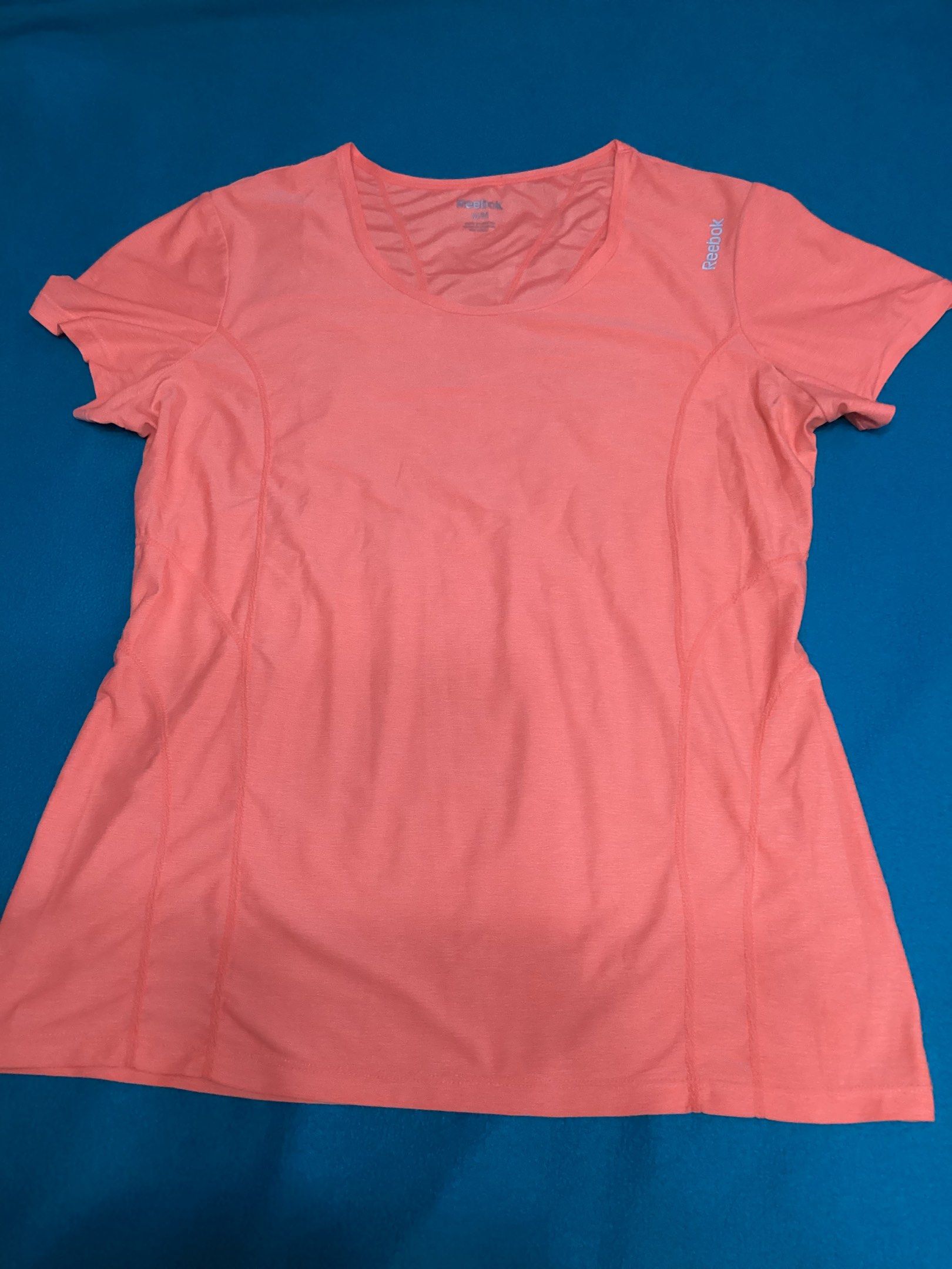 Reebok Orange Athletic T-shirt (Category: Activewear) located in Davao. Submitted by ferdipt (Listing ID 1418779982, Image 3). Description: Designed for training & fitness For Women Size: M Made in Lesotho 96% Polyester, 4% Spandex.