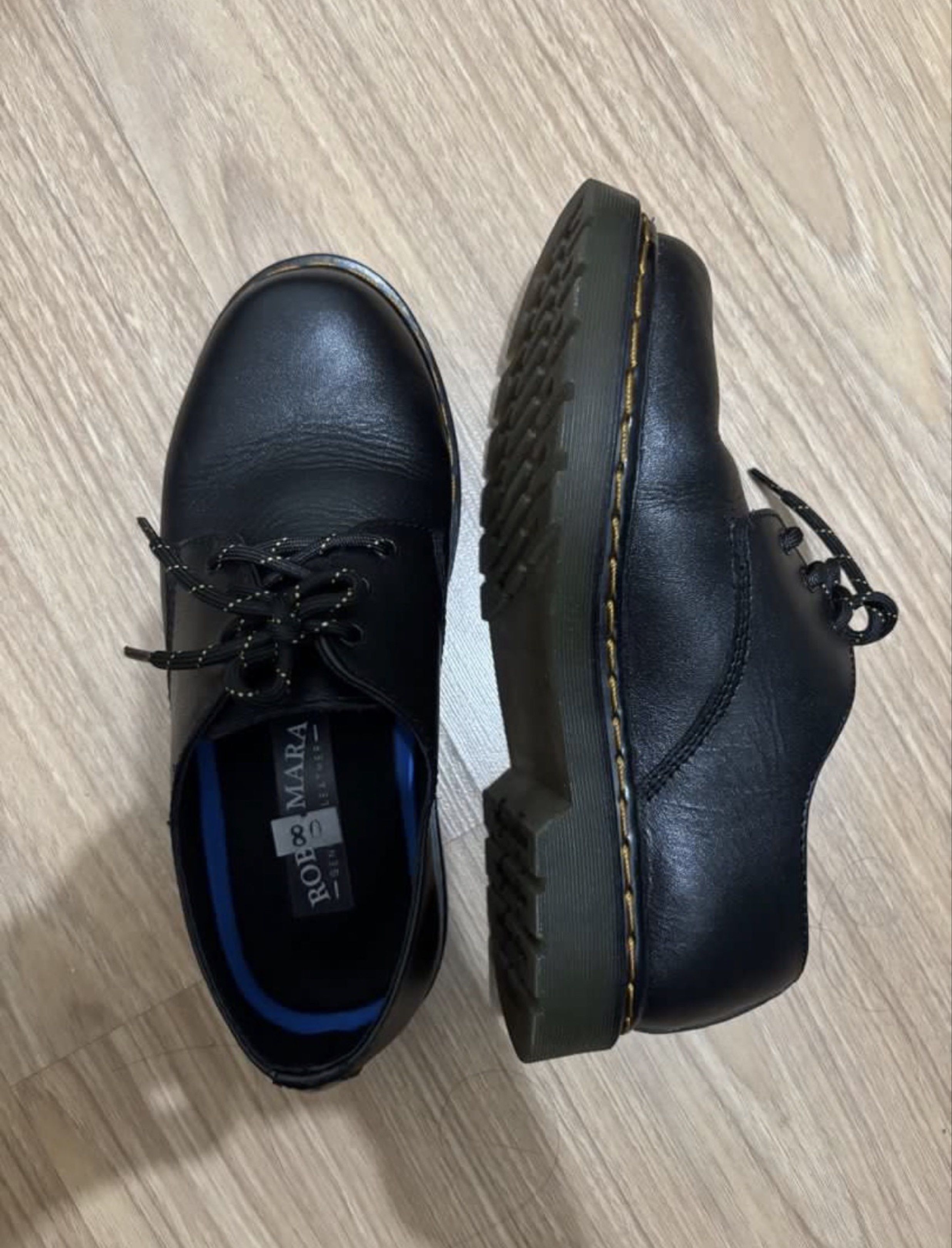 Rob & Mara Black Leather Shoes (Category: Loafers) located in Guimba. Submitted by nine__ (Listing ID 1418896159, Image 2). Description: - Brand: Rob & Mara - Style: Derby shoes - Material: Black leather - Closure: Lace-up - Sole: Sturdy with stitching - Insole: Blue lining - Condition: Good rfs : too big for me.
