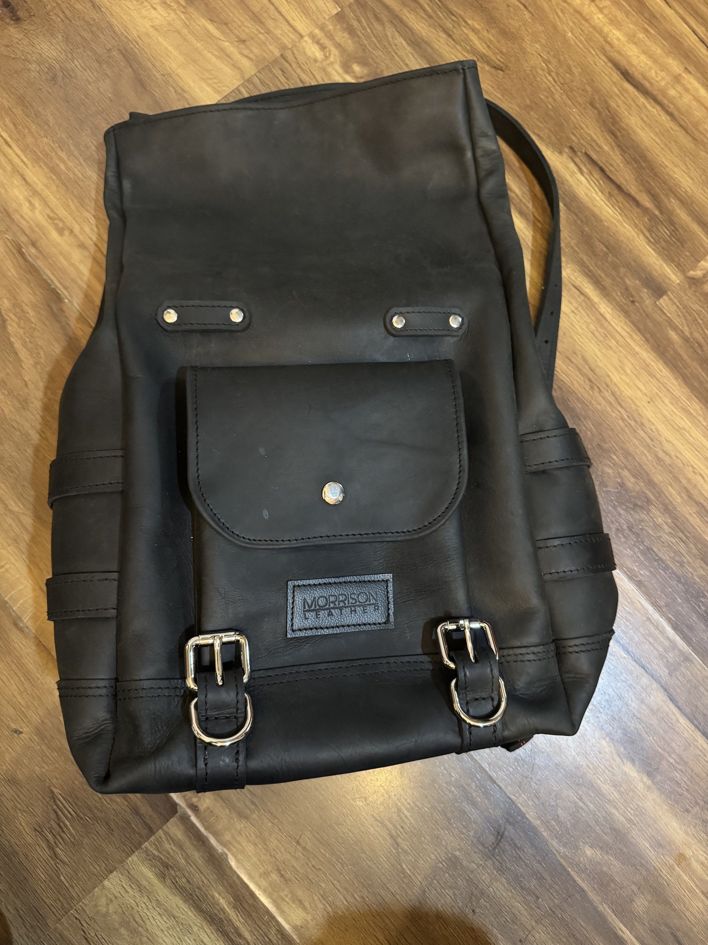 Sissy bar bag + Back pack Genuine Cowhide Leather for Classic Bike Harley Davidson (Category: Other Motorcycles Parts and Accessories) located in Manila. Submitted by leonardo.declutter (Listing ID 1418931294, Image 1). Description: - Morrison Leather black leather backpack - Front pocket with snap closure - Silver buckles - Adjustable straps - Includes rain cover - Laptop compartment - Durable and stylish design.