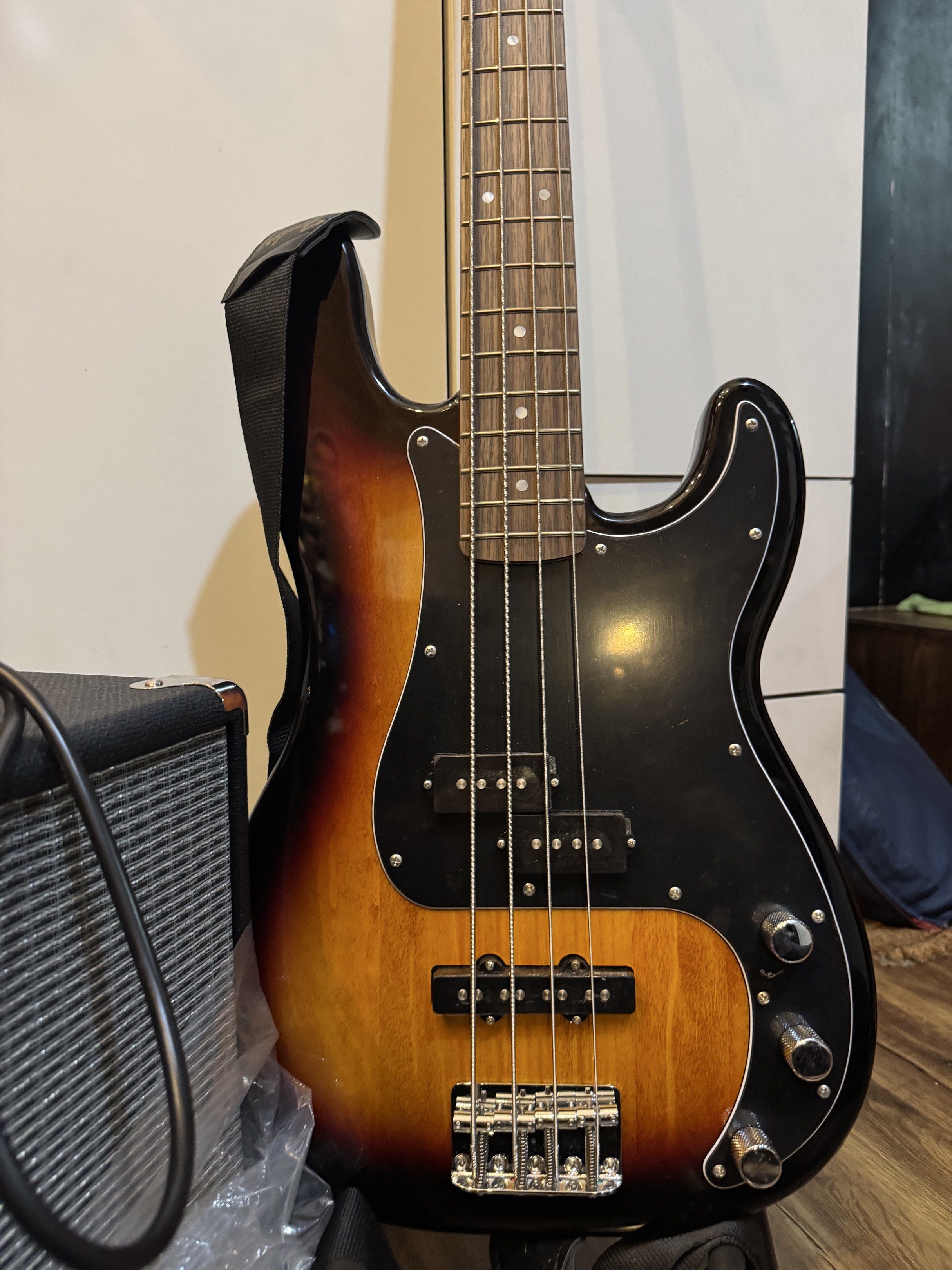 Squier Precision Bass Guitar with Fender Amplifier (Category: Musical Instruments) located in Manila. Submitted by leonardo.declutter (Listing ID 1418930112, Image 2). Description: - Squier Precision Bass guitar - Almost BRAND NEW - Sunburst finish - Black pickguard - Fender amplifier - Includes cable - With "FREE ONLINE LESSONS" tag - With Bass Bag - With plastics and tags RFS: Extra Unit No box.