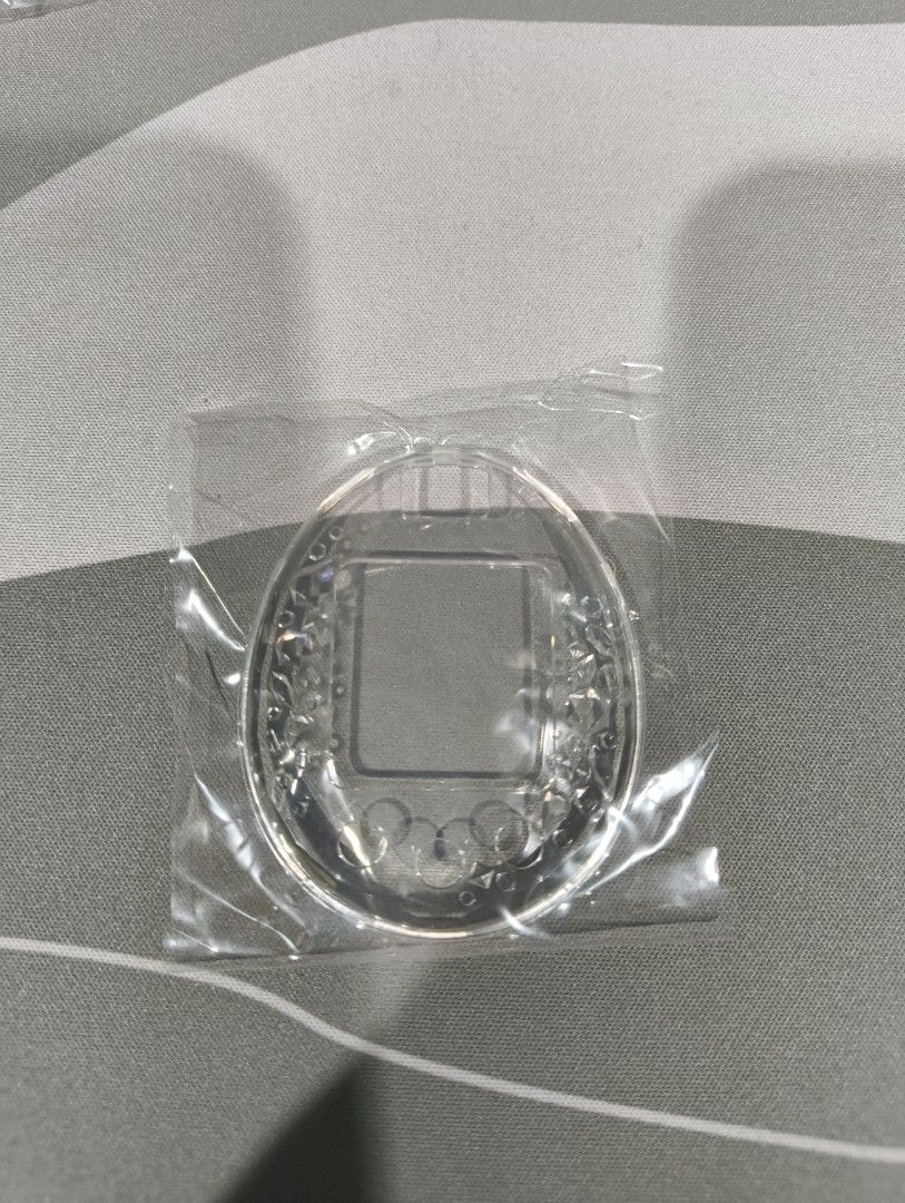 Tamagotchi P's Clear Faceplate ONLY (Category: Interactive Toys) located in Taguig. Submitted by Artxious (Listing ID 1418858516, Image 1). Description: Got this over at Etsy. Full disclosure, it's not a perfect fit because it is handmade, may some areas na masikip, but if you get it right, it fits really well, and when you have a Pierce plug, it will fit nicely. Price includes the full price of 1 faceplate + half of my SF..