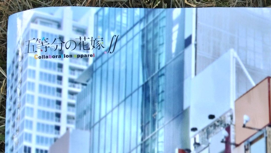 The Quintessential Quintuplets A0 Collaboration Poster (Category: Art & Prints) located in Manila. Submitted by newage.vintage (Listing ID 1418890380, Image 3). Description: - A0 size poster featuring The Quintessential Quintuplets. - Collaboration apparel item. - Depicts the quintuplets in a city scene. - Poster is new and rolled. - Includes packaging with Japanese text. -47x34 inches .