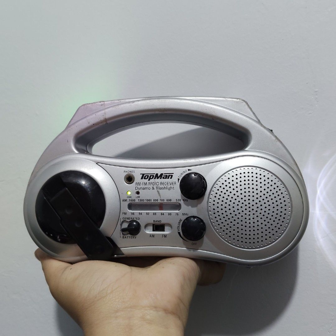 TopMan AM/FM Dynamo Radio w/ Flashlight (Category: Portable Music Players) located in Catbalogan. Submitted by jpnsrpls (Listing ID 1418976206, Image 1). Description: 📻 TopMan AM/FM Dynamo Radio w/ Flashlight ✅ ALL FUNCTIONS WORKING & TESTED 🔊 AM / FM radio 🔦 Built-in flashlight 🔄 Hand-crank (dynamo) power 🔌 With charging jack (no rechargeable battery included) 🔋 Battery-operated 🎧 With earphone jack 🧳 Portable with carry handle.