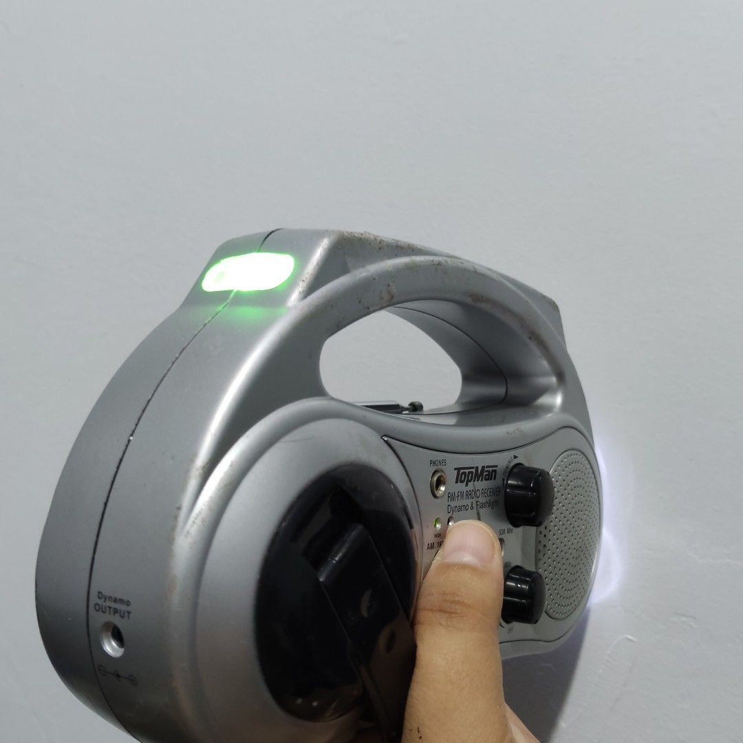 TopMan AM/FM Dynamo Radio w/ Flashlight (Category: Portable Music Players) located in Catbalogan. Submitted by jpnsrpls (Listing ID 1418976206, Image 3). Description: 📻 TopMan AM/FM Dynamo Radio w/ Flashlight ✅ ALL FUNCTIONS WORKING & TESTED 🔊 AM / FM radio 🔦 Built-in flashlight 🔄 Hand-crank (dynamo) power 🔌 With charging jack (no rechargeable battery included) 🔋 Battery-operated 🎧 With earphone jack 🧳 Portable with carry handle.