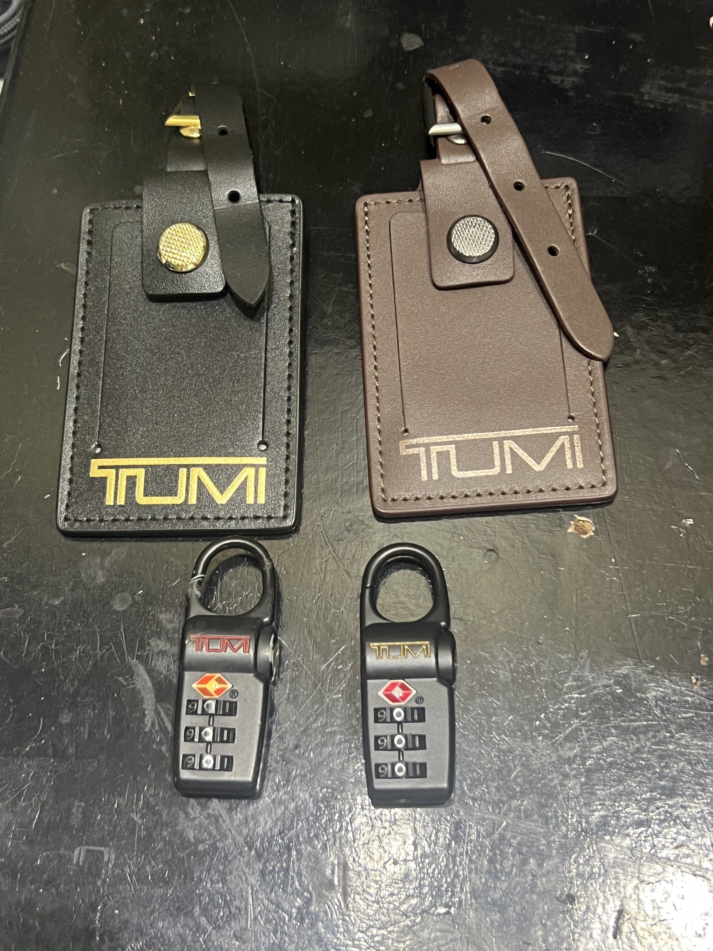 TUMI accessories (Category: Luxury Bags & Wallets) located in Quezon City. Submitted by emter (Listing ID 1418779920, Image 1). Description: TUMI (Original) accessories Bag tag (Bnew) Black with gold - 1,500 Brown - 1,350 Padlock Bnew - 1,300 Used - 950.