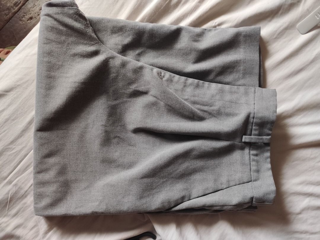 Uniqlo Wide Leg Trouser (Category: Jeans) located in Mandaluyong City. Submitted by msdeclutterfinds (Listing ID 1418829315, Image 3). Description: - Uniqlo Gray Wide-Leg Pants - Size: XL on tag. But best fit for Medium to Large built. - Waist: 75-81cm (31 to 32 inches) - Hips: 100-106cm - Length: 32 inches - Material: Polyester & Spandex - Features: Classic design with pleats - Perfect for a comfortable and stylish look.
